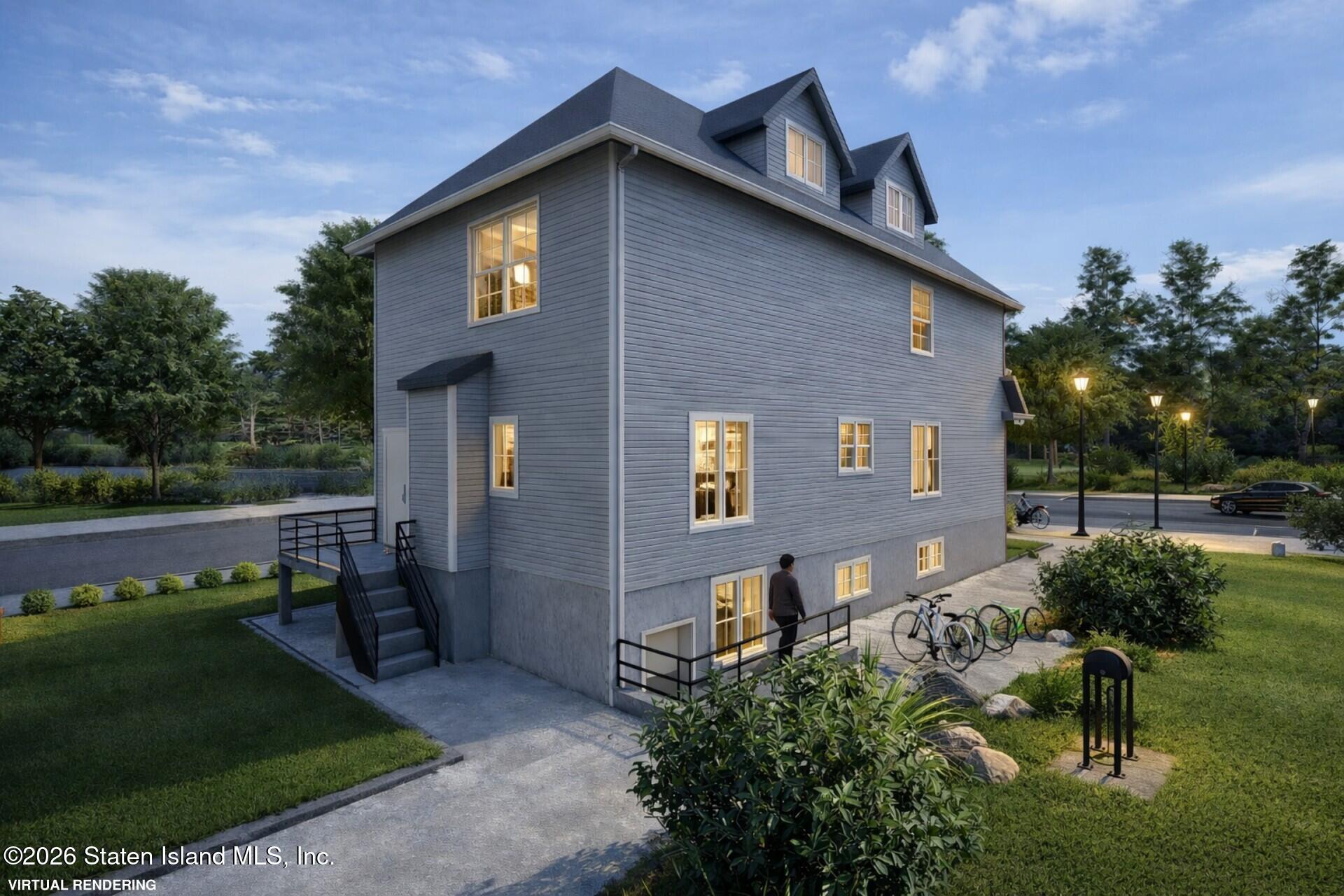 7036 Amboy Road Staten Island, NY 10307 - Photo 3 of 13 a front view of a house with a yard
