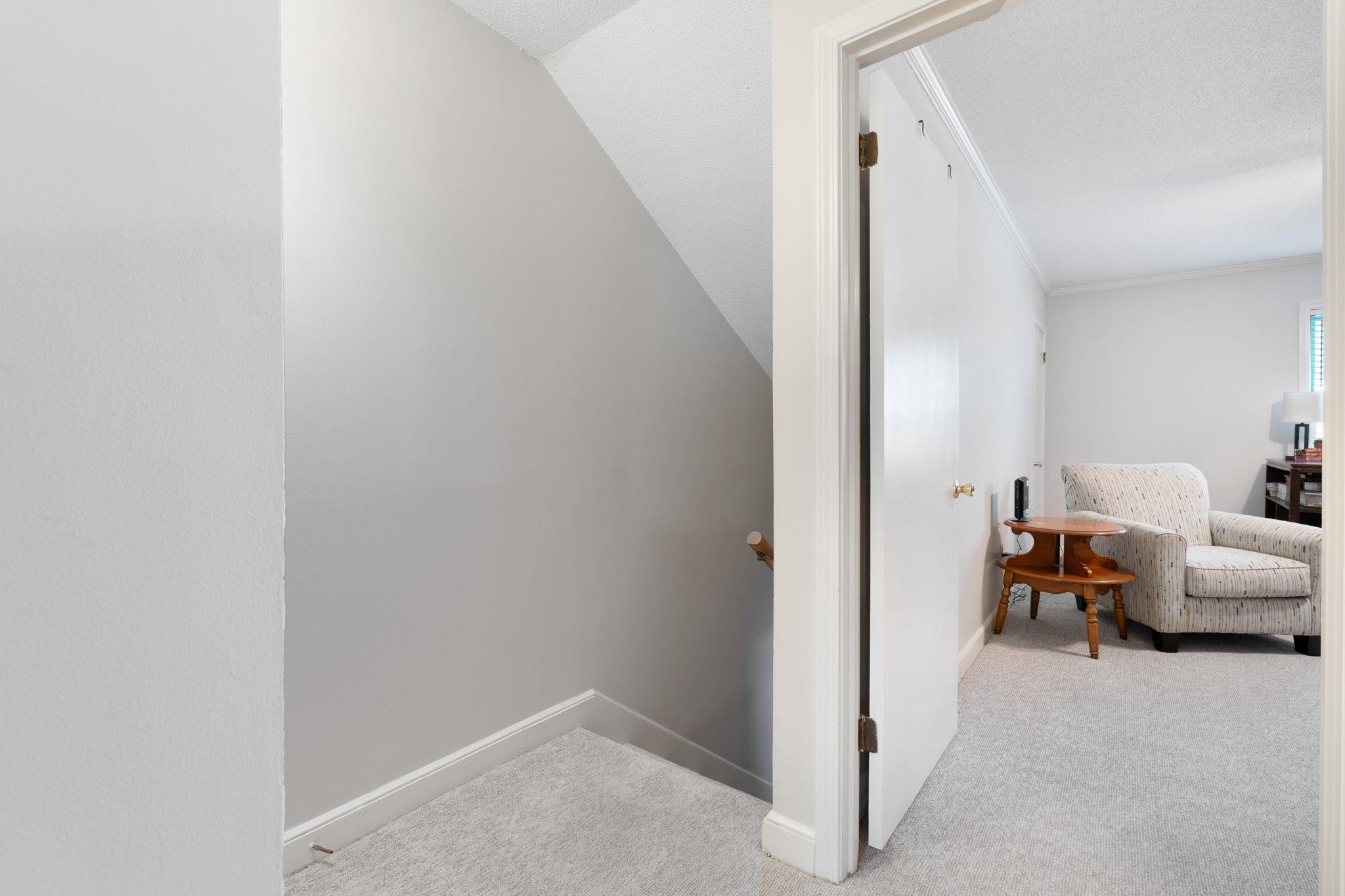 5726 Quince Road, Unit 9 Memphis, TN 38119 - Photo 12 of 18 Hallway with light carpet and vaulted ceiling