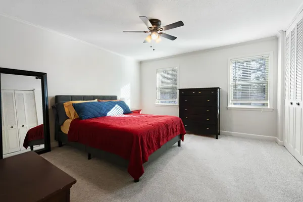 a bathroom with a sink a toilet and shower curtain