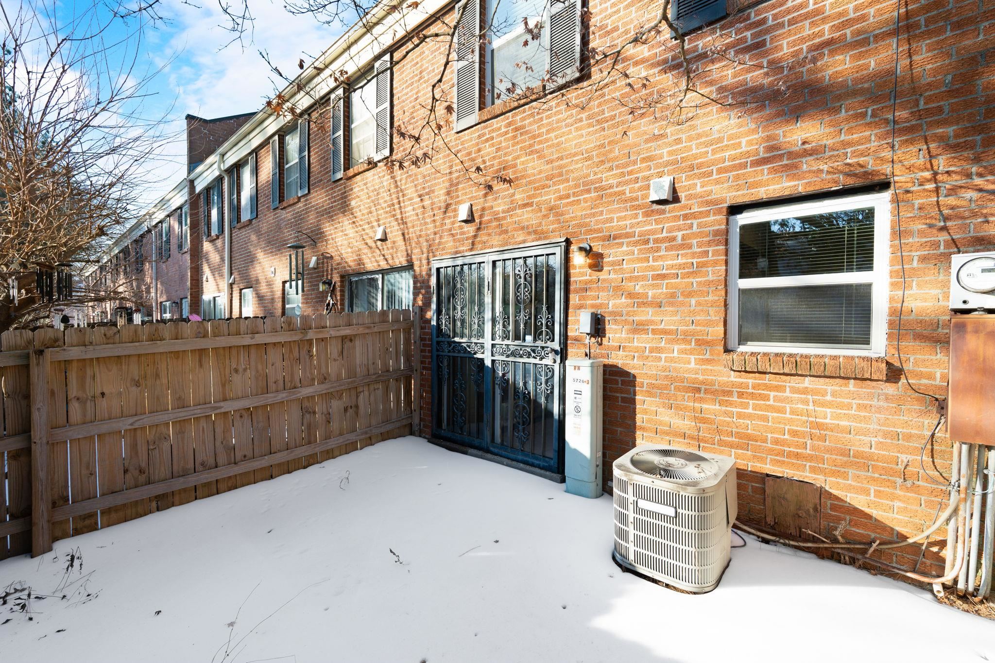 5726 Quince Road, Unit 9 Memphis, TN 38119 - Photo 17 of 18 Doorway to property with brick siding