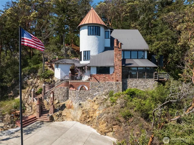 a aerial view of a house with table and chairs