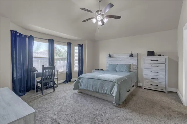 a bedroom with a bed furniture and a window