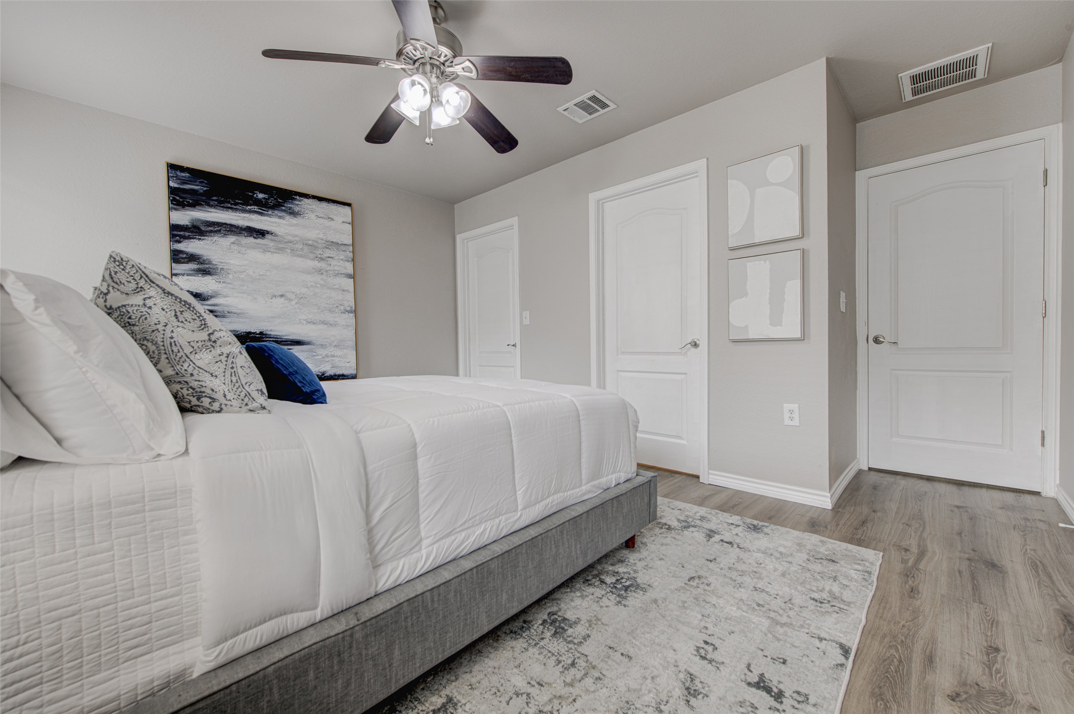 6709 Doyal Drive Austin, TX 78747 - Photo 18 of 22 Bedroom featuring light wood finished floors and ceiling fan