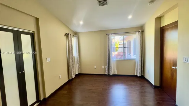 a view of a balcony with wooden floor