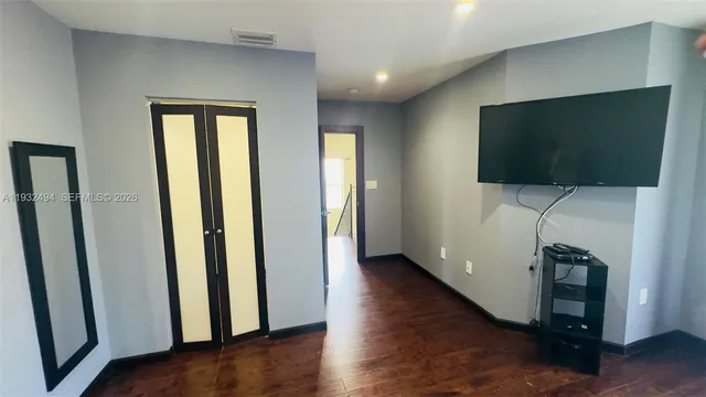 a view of a park with palm trees