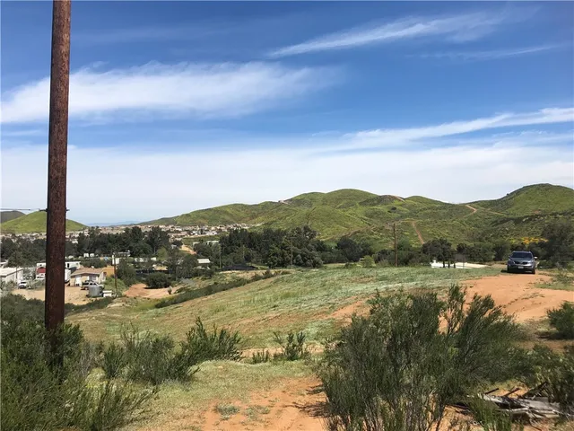 a view of a town with mountains in the background