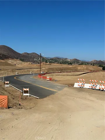 a view of a lake with houses in the background