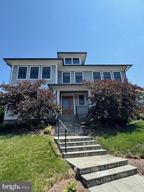 497 North Abingdon Street Arlington, VA 22203 - Photo 1 of 64 a front view of a house with a garden