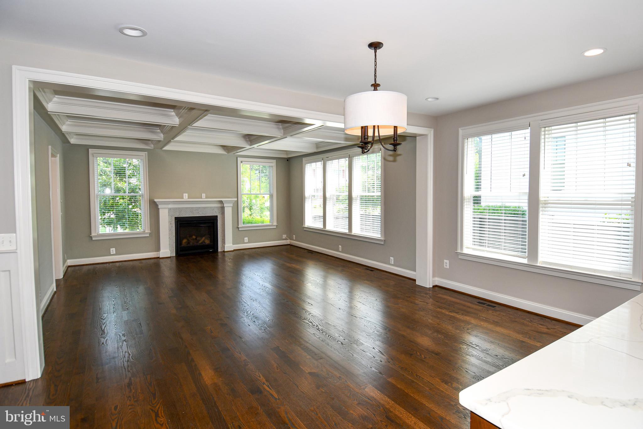 497 North Abingdon Street Arlington, VA 22203 - Photo 12 of 64 a view of an empty room with wooden floor and a window
