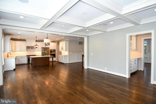 a kitchen with a counter space sink and cabinets