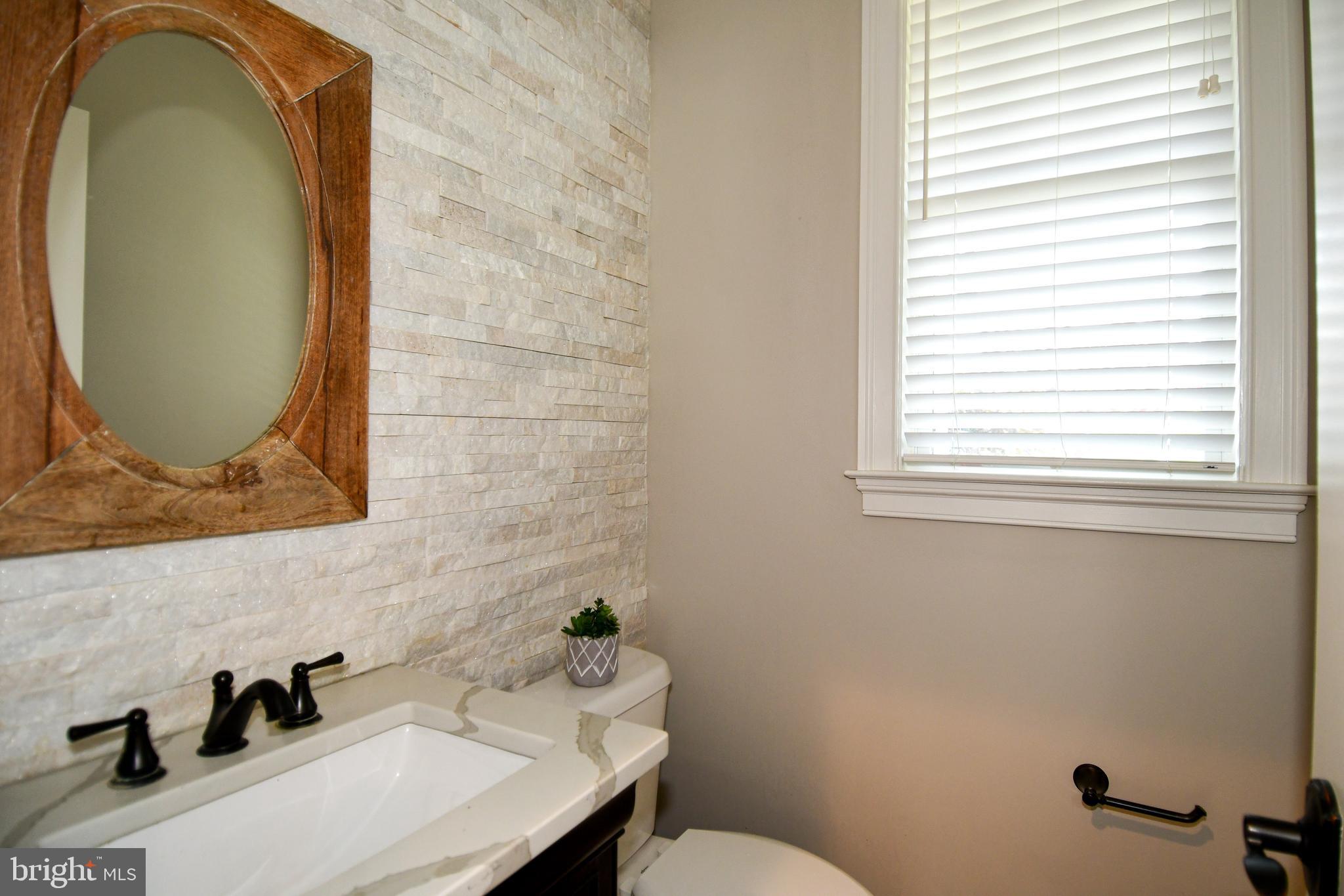 497 North Abingdon Street Arlington, VA 22203 - Photo 15 of 64 a bathroom with a sink and a mirror