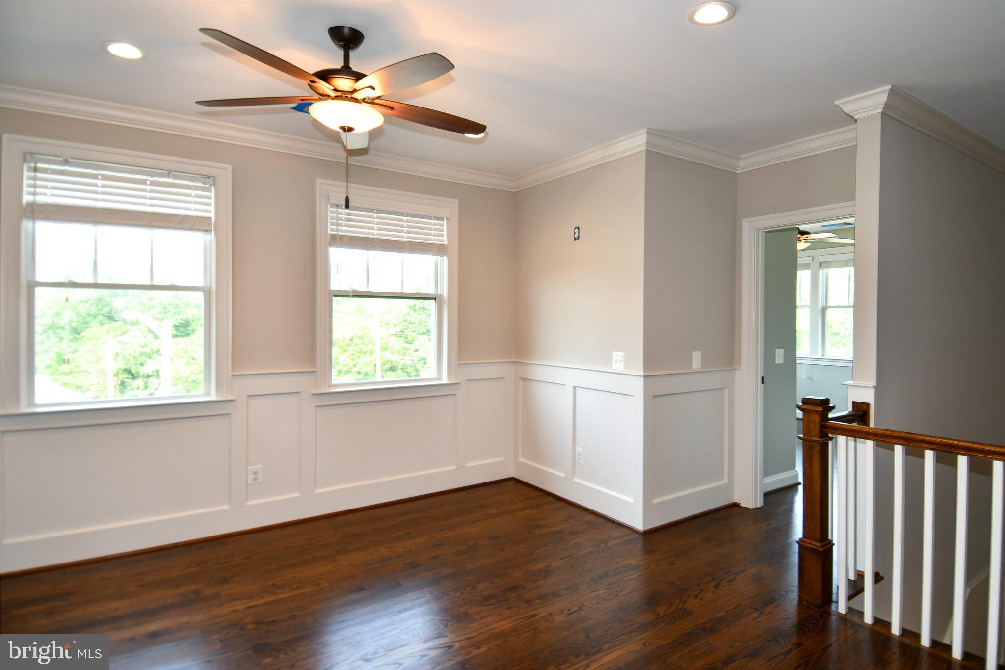 497 North Abingdon Street Arlington, VA 22203 - Photo 20 of 64 a view of an empty room with wooden floor and a window