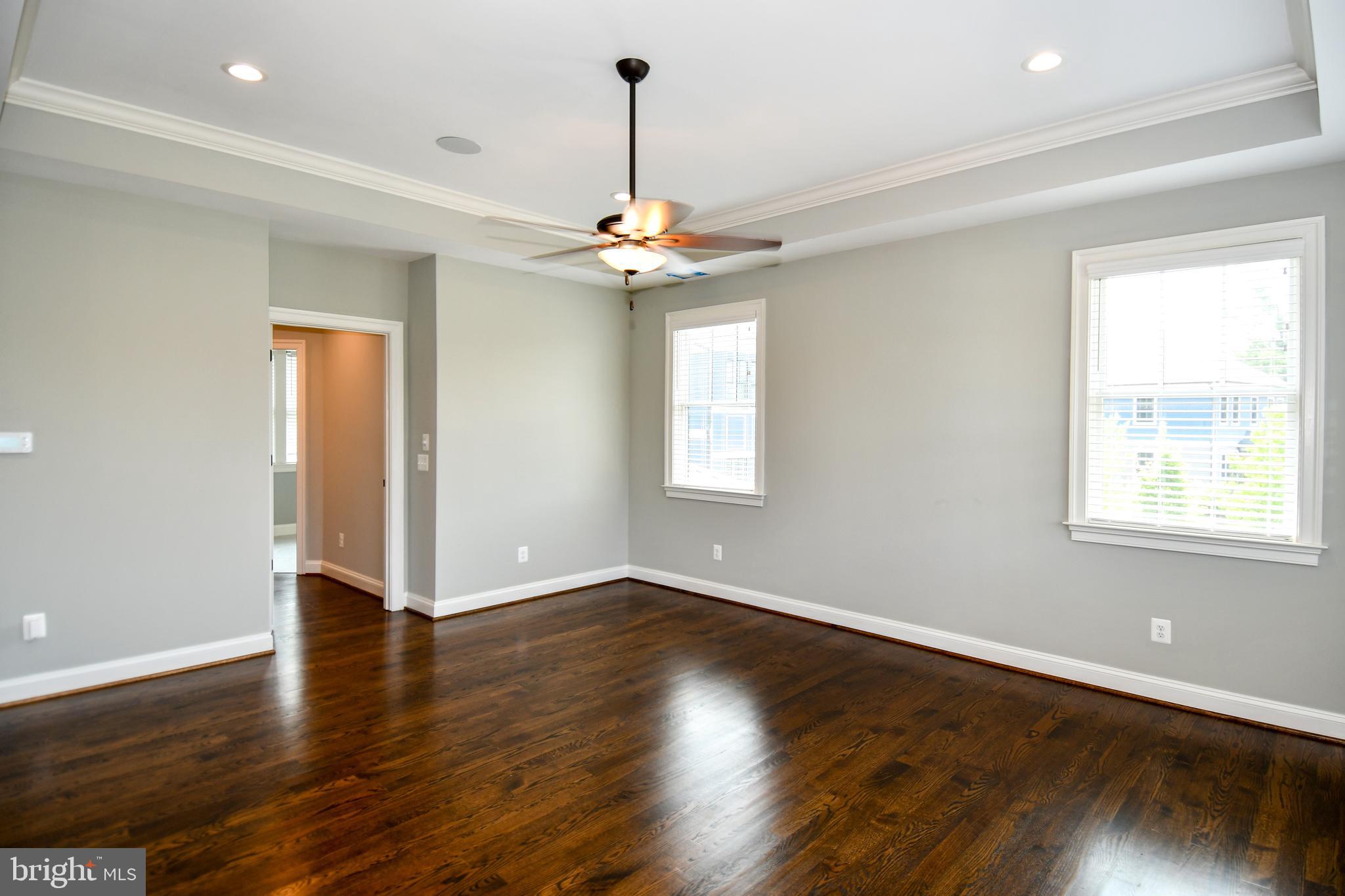 497 North Abingdon Street Arlington, VA 22203 - Photo 21 of 64 a view of an empty room with wooden floor and a window