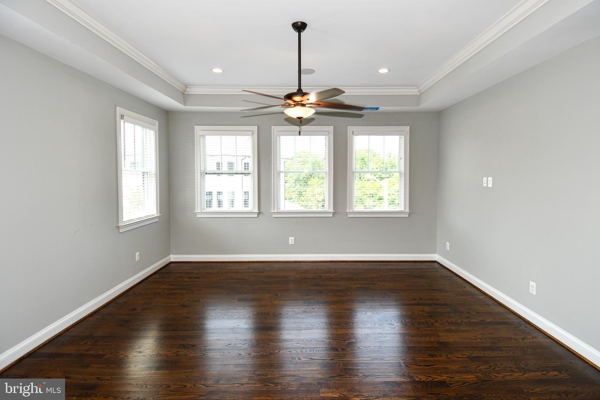 497 North Abingdon Street Arlington, VA 22203 - Photo 26 of 64 a view of an empty room with wooden floor and a window