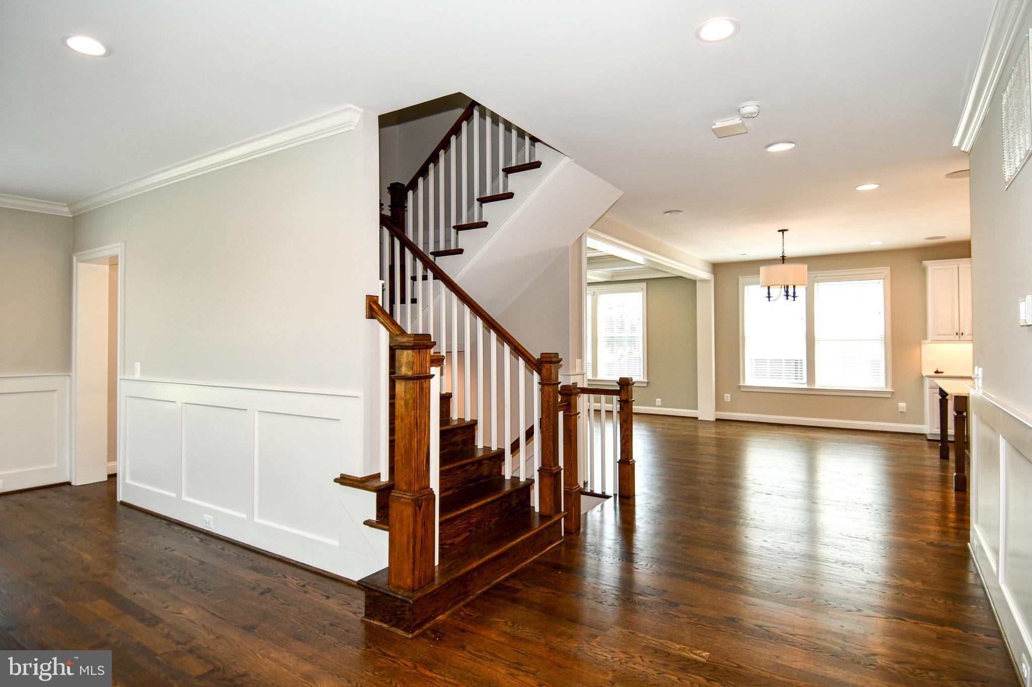 497 North Abingdon Street Arlington, VA 22203 - Photo 3 of 64 a view of an entryway with wooden floor and stairs
