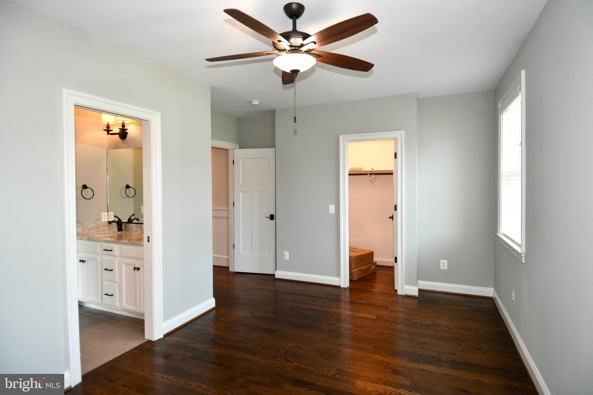 497 North Abingdon Street Arlington, VA 22203 - Photo 31 of 64 a view of an empty room with window and wooden floor