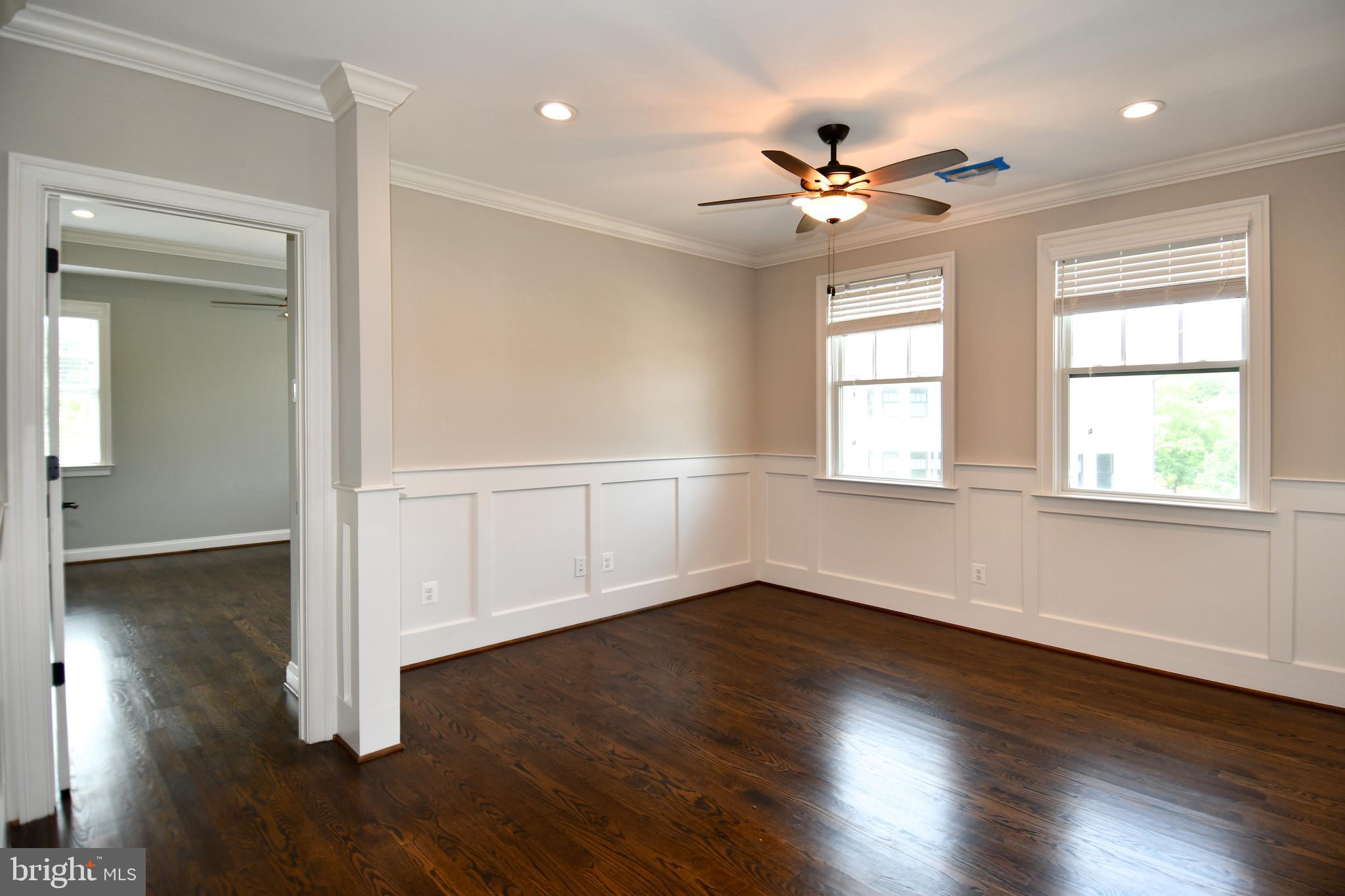 497 North Abingdon Street Arlington, VA 22203 - Photo 32 of 64 a view of an empty room with wooden floor and a window