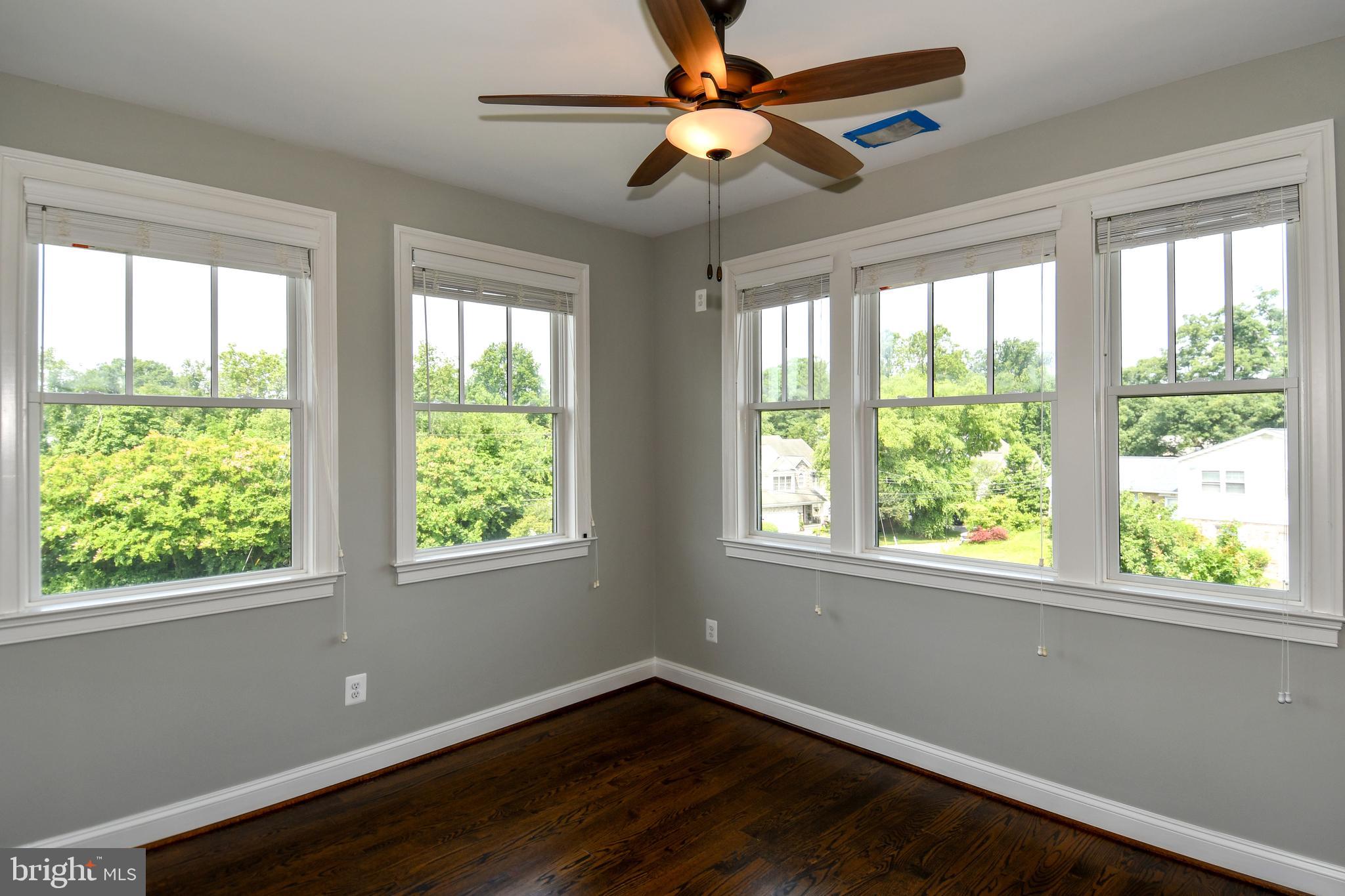 497 North Abingdon Street Arlington, VA 22203 - Photo 33 of 64 a view of an empty room with wooden floor and a window