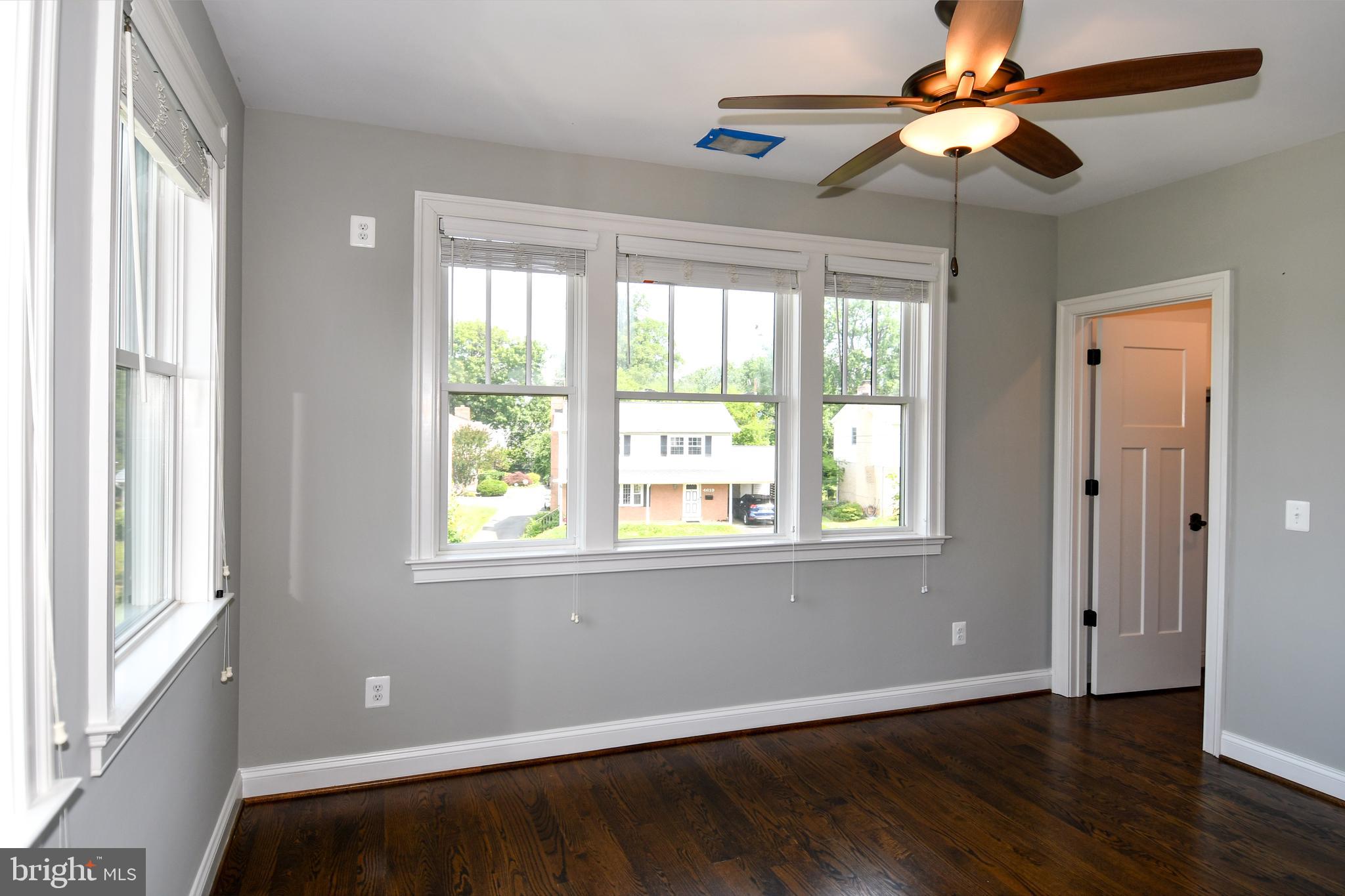 497 North Abingdon Street Arlington, VA 22203 - Photo 36 of 64 a view of an empty room with wooden floor and a window