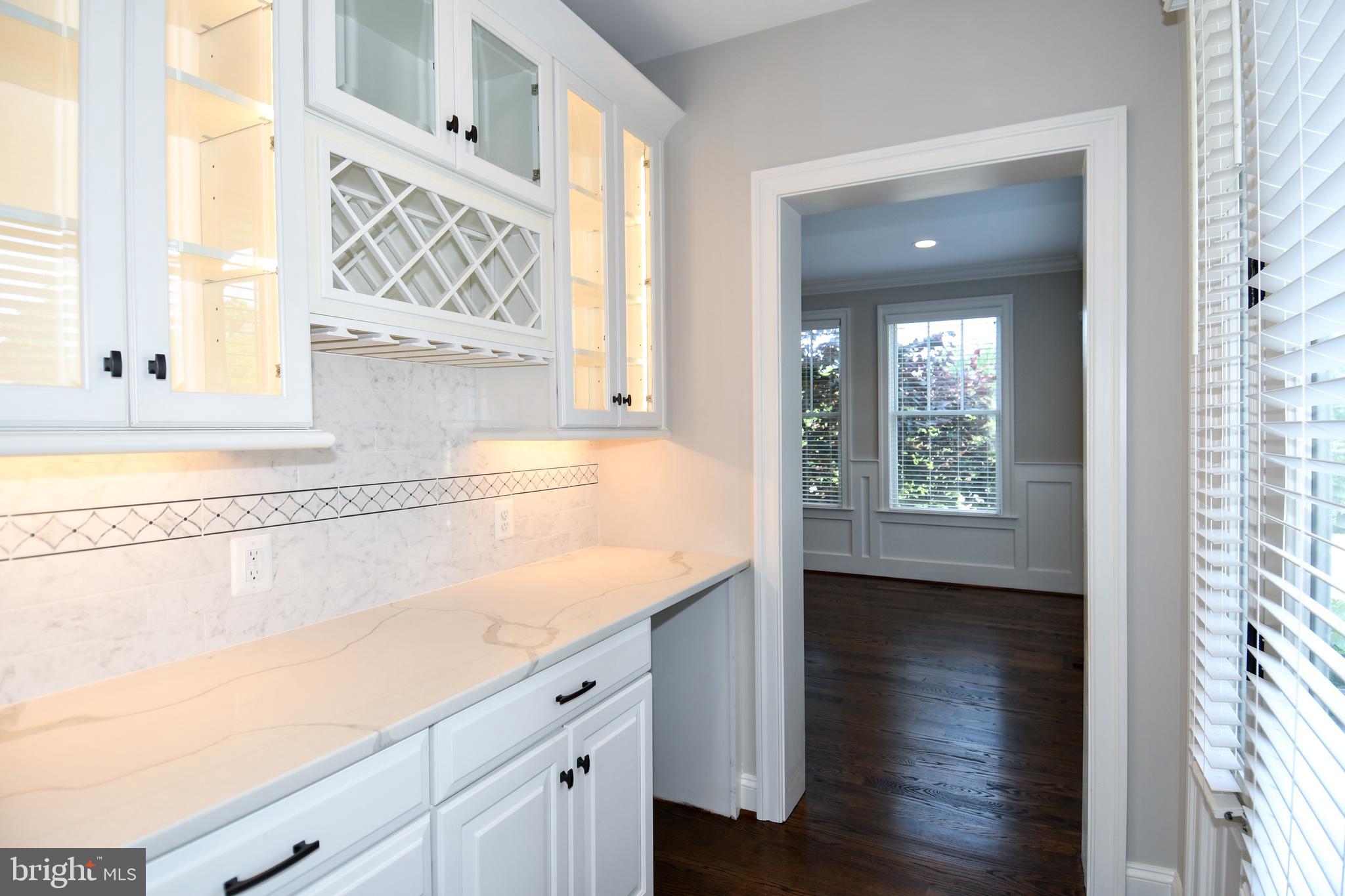 497 North Abingdon Street Arlington, VA 22203 - Photo 43 of 64 a view of a kitchen with wooden floor and staircase
