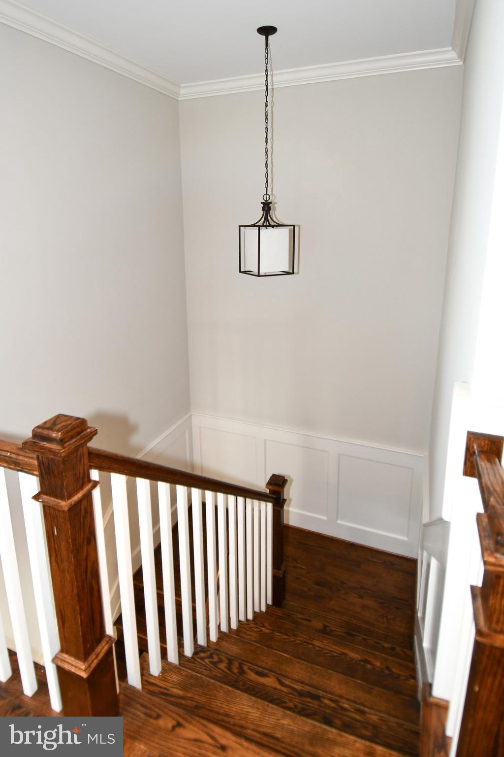 497 North Abingdon Street Arlington, VA 22203 - Photo 48 of 64 a view of a hallway with a chandelier
