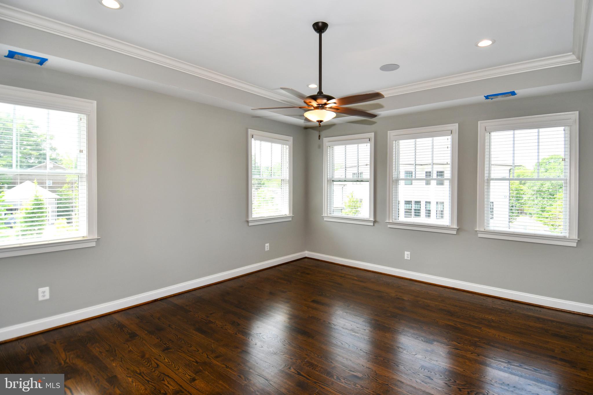 497 North Abingdon Street Arlington, VA 22203 - Photo 50 of 64 a view of an empty room with wooden floor and a window