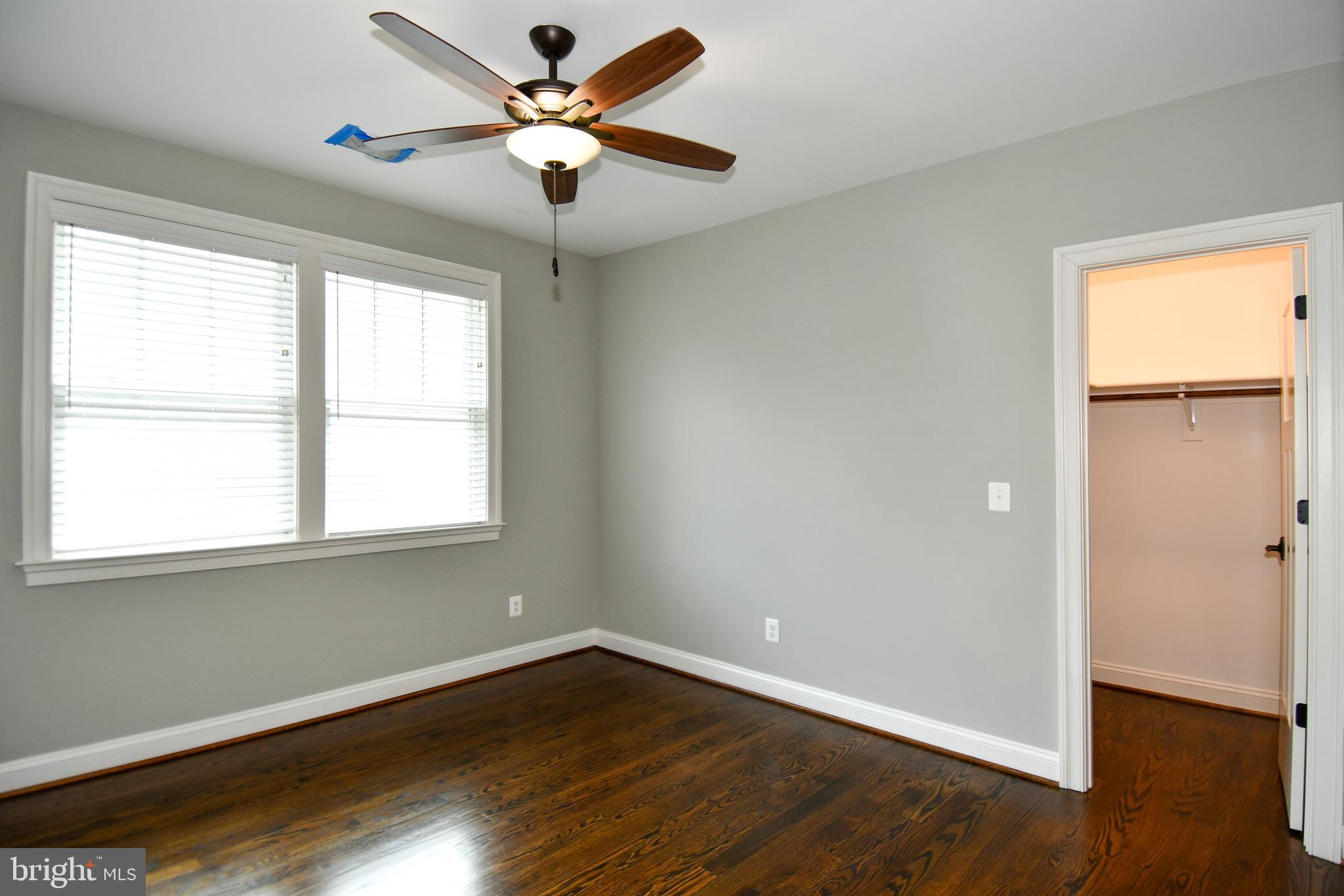497 North Abingdon Street Arlington, VA 22203 - Photo 53 of 64 a view of an empty room with wooden floor and a window