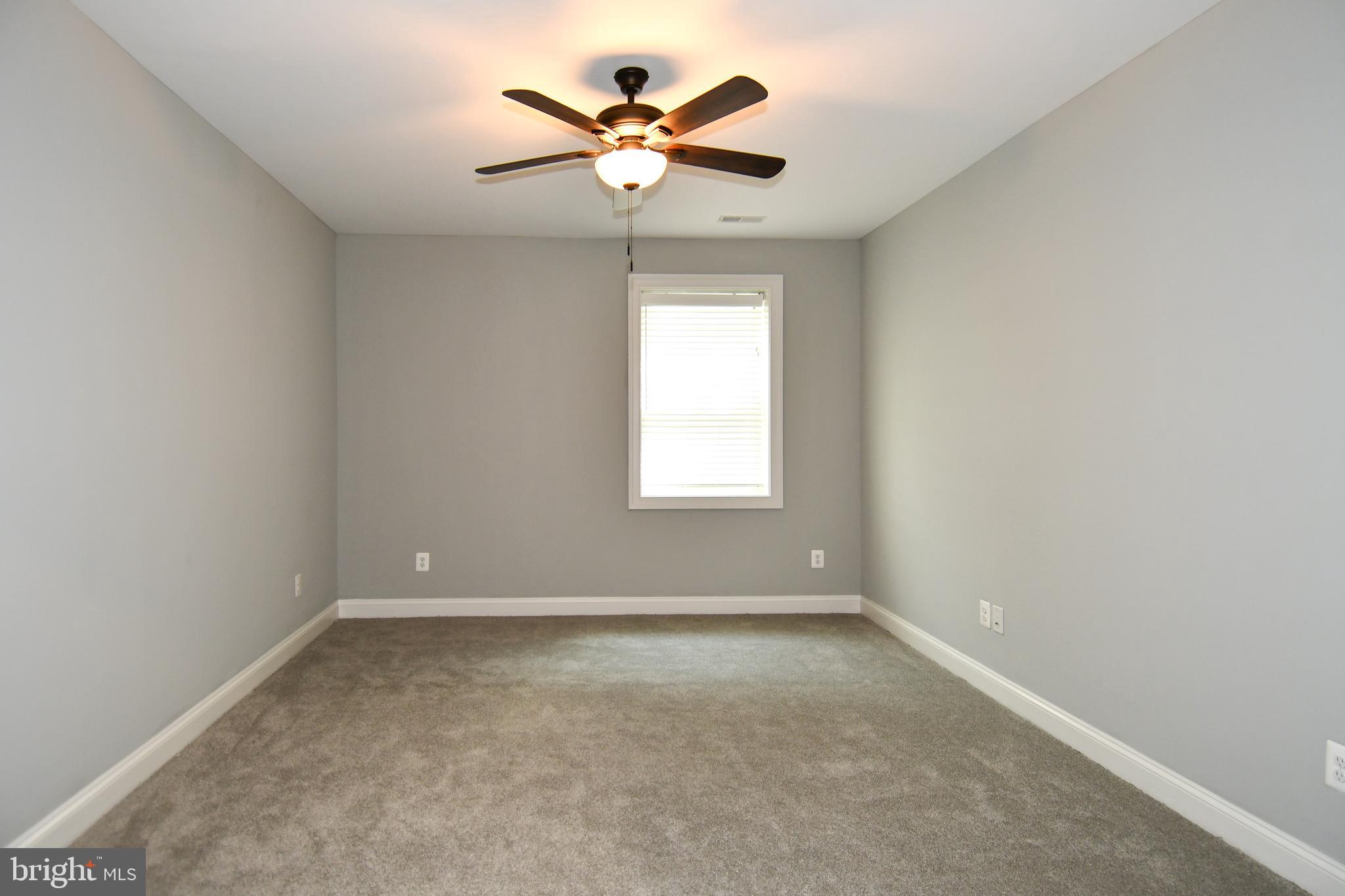 497 North Abingdon Street Arlington, VA 22203 - Photo 58 of 64 an empty room with a window and a fan