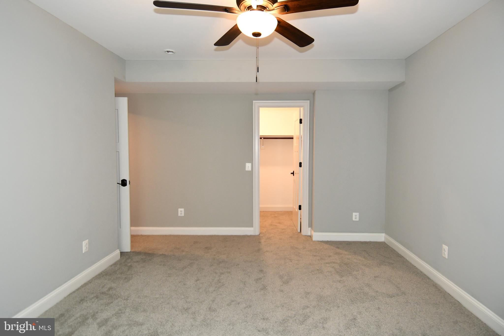 497 North Abingdon Street Arlington, VA 22203 - Photo 59 of 64 a view of an empty room and chandelier fan