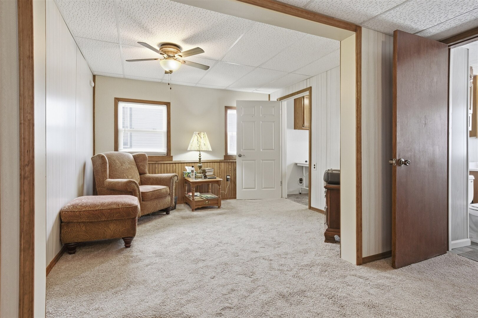 603 West Chestnut Street Bloomington, IL 61701 - Photo 13 of 24 a living room with furniture and a chandelier