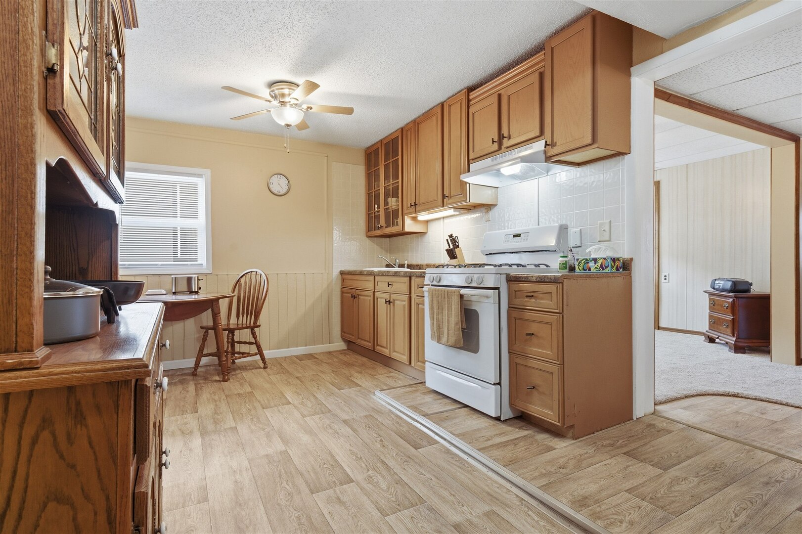 603 West Chestnut Street Bloomington, IL 61701 - Photo 15 of 24 a kitchen with a stove a refrigerator and wooden cabinets