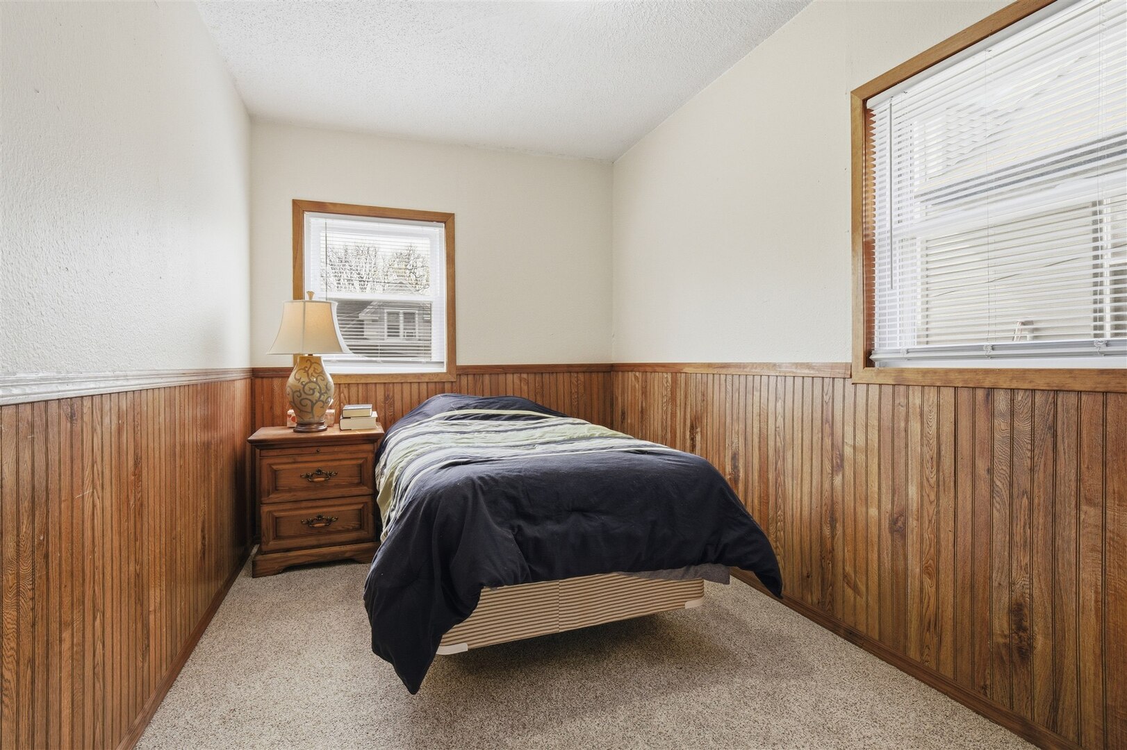 603 West Chestnut Street Bloomington, IL 61701 - Photo 18 of 24 a bed sitting in a bedroom next to a window