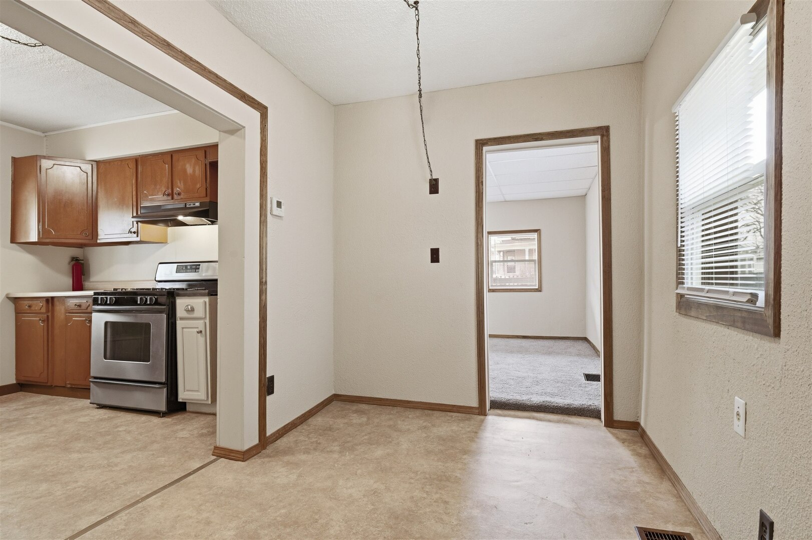 603 West Chestnut Street Bloomington, IL 61701 - Photo 5 of 24 a view of kitchen with sink stove and refrigerator