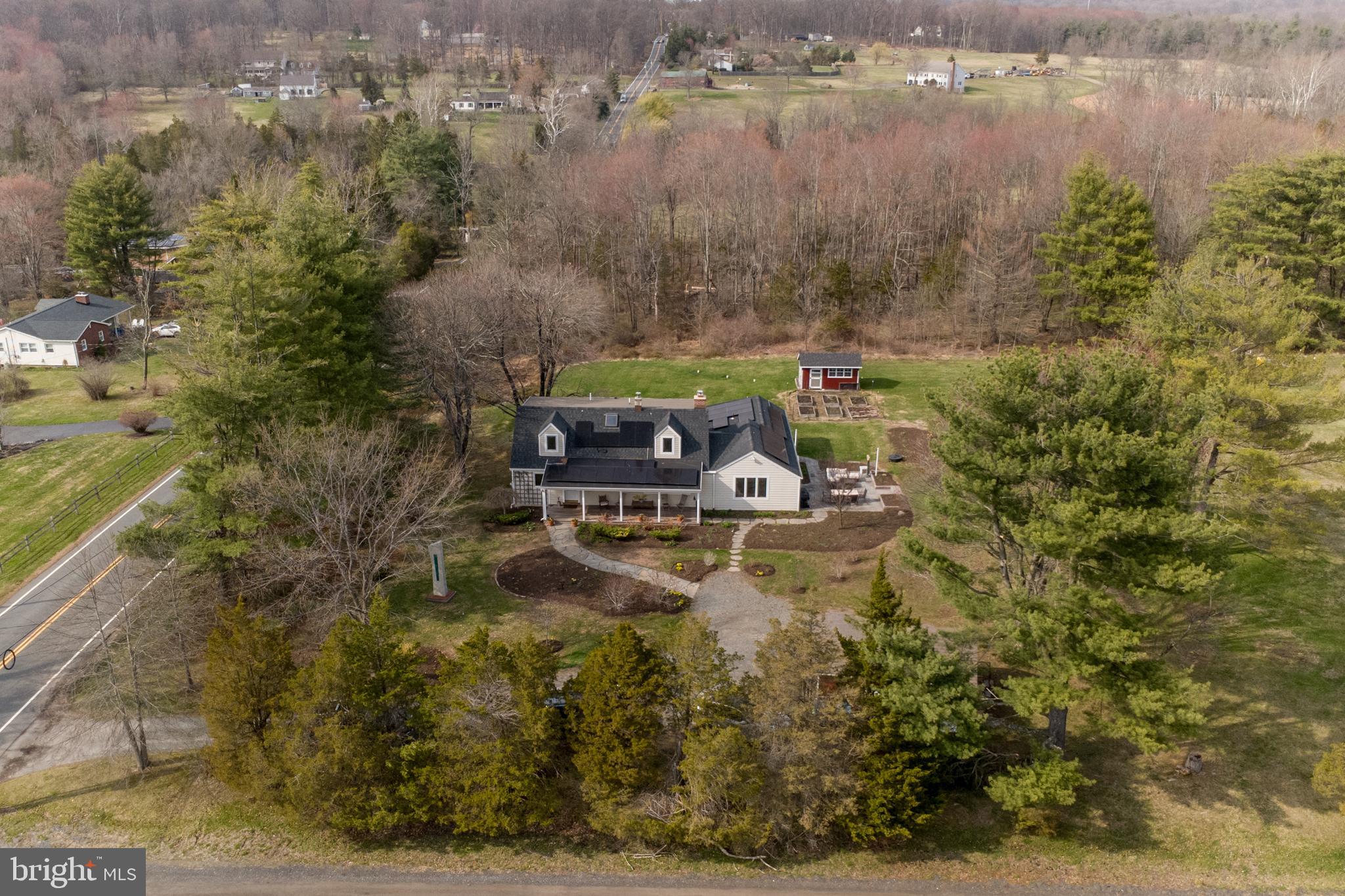 1714-linvale-harbourton R Linvale Harbourton Road Hopewell, NJ 08525 - Photo 2 of 46 a aerial view of a house with a yard