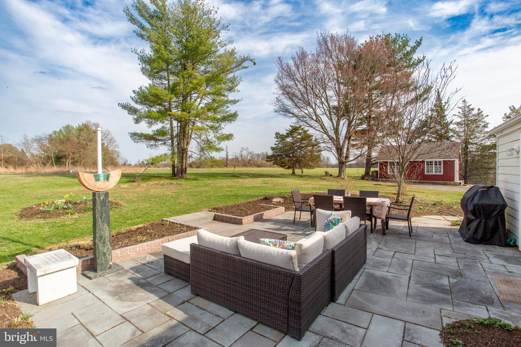 1714-linvale-harbourton R Linvale Harbourton Road Hopewell, NJ 08525 - Photo 22 of 46 a view of a patio with couches and table and chairs and potted plants