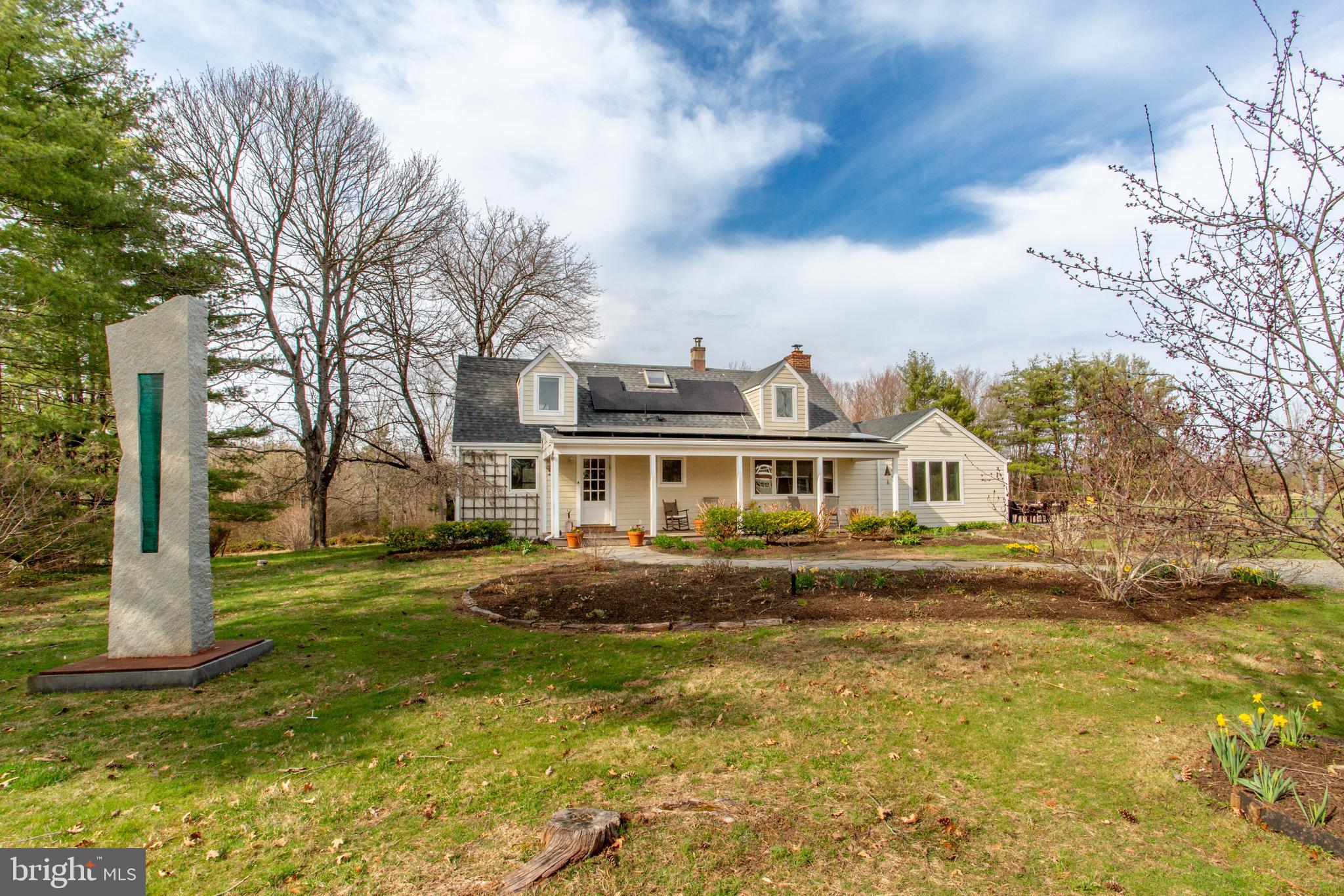 1714-linvale-harbourton R Linvale Harbourton Road Hopewell, NJ 08525 - Photo 3 of 46 a front view of a house with a garden