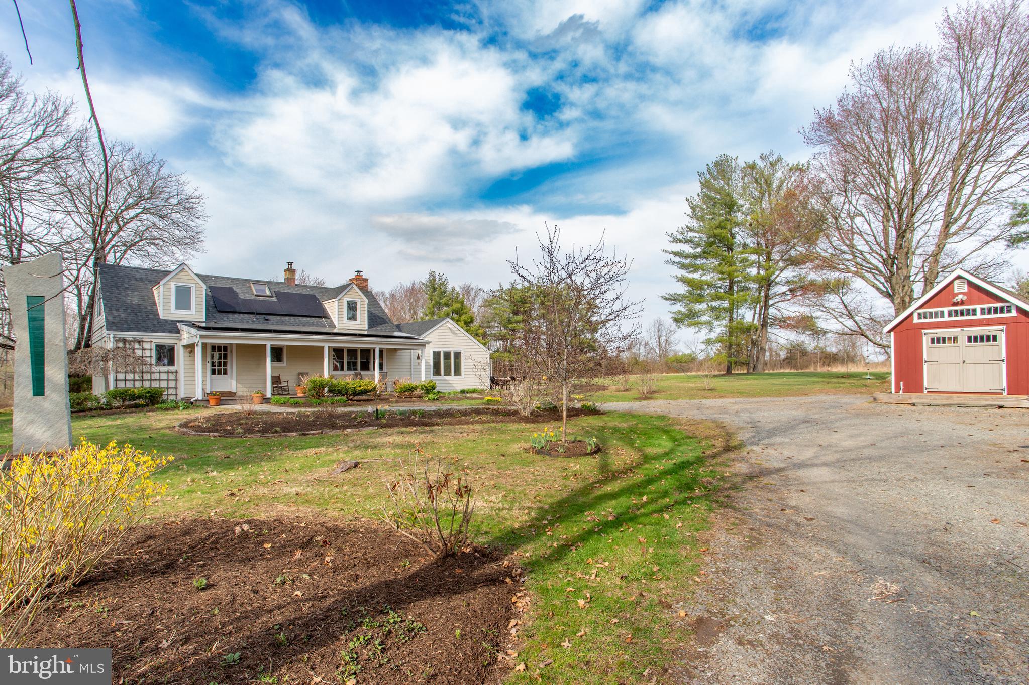1714-linvale-harbourton R Linvale Harbourton Road Hopewell, NJ 08525 - Photo 4 of 46 a front view of a house with a yard