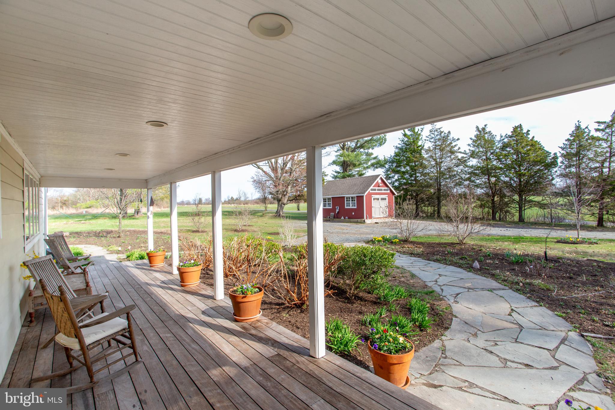 1714-linvale-harbourton R Linvale Harbourton Road Hopewell, NJ 08525 - Photo 6 of 46 a view of a patio with lawn chairs next to a yard