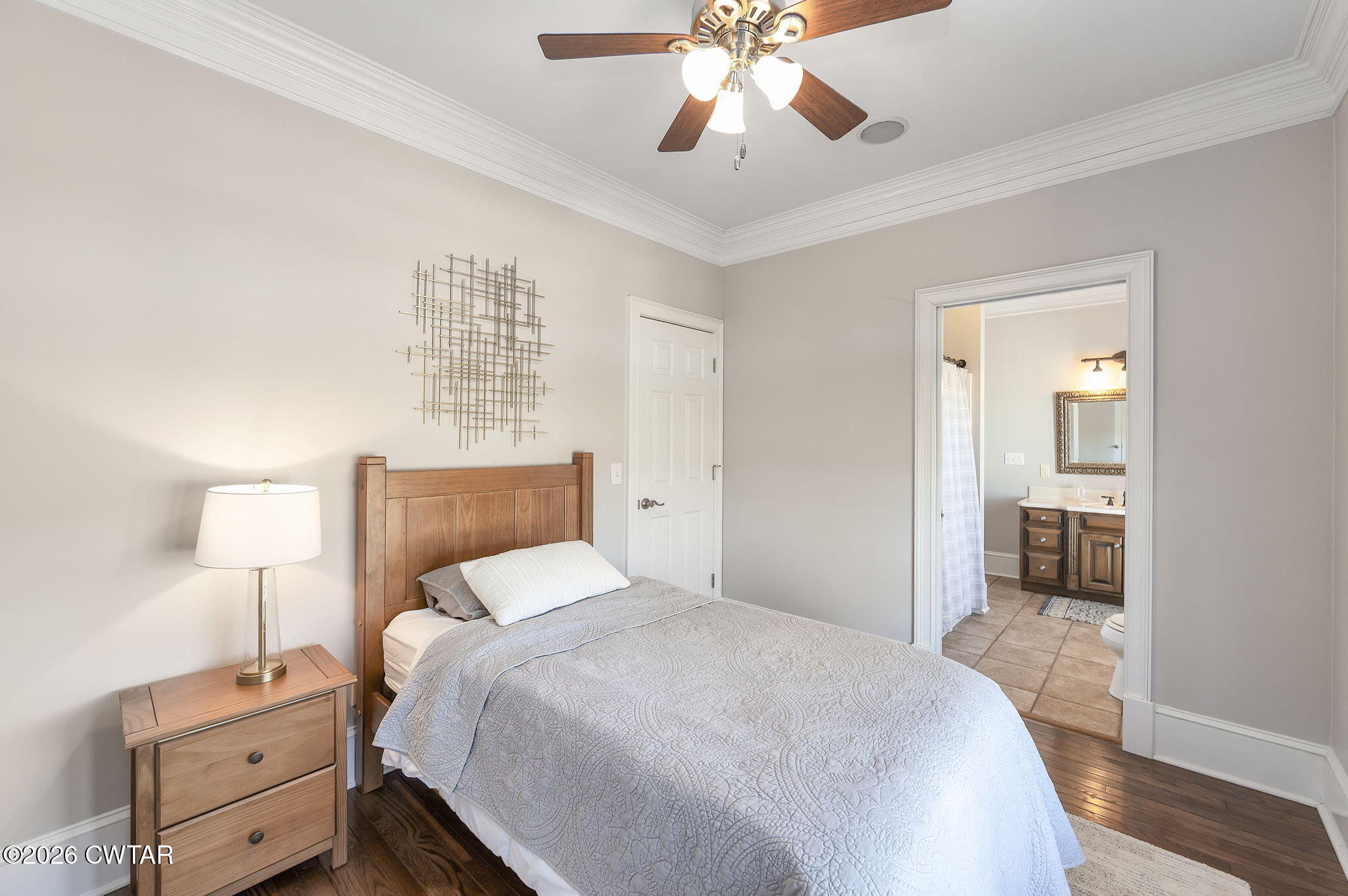 4320 Timberlake-Wildersville Road Lexington, TN 38351 - Photo 21 of 58 a bedroom with a bed and a chandelier