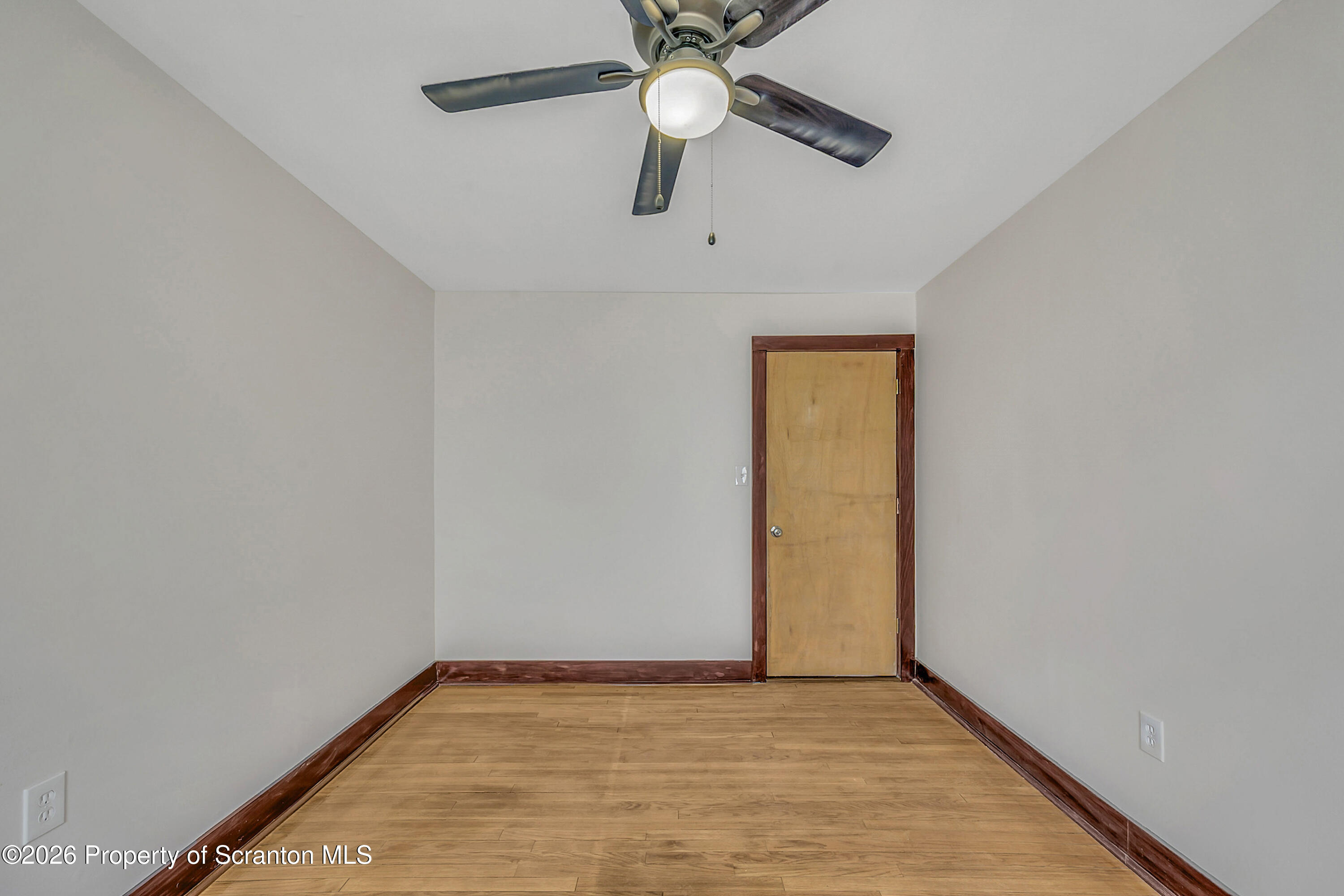 2309 Ash Street Scranton, PA 18510 - Photo 12 of 46 a view of an empty room with window and chandelier fan