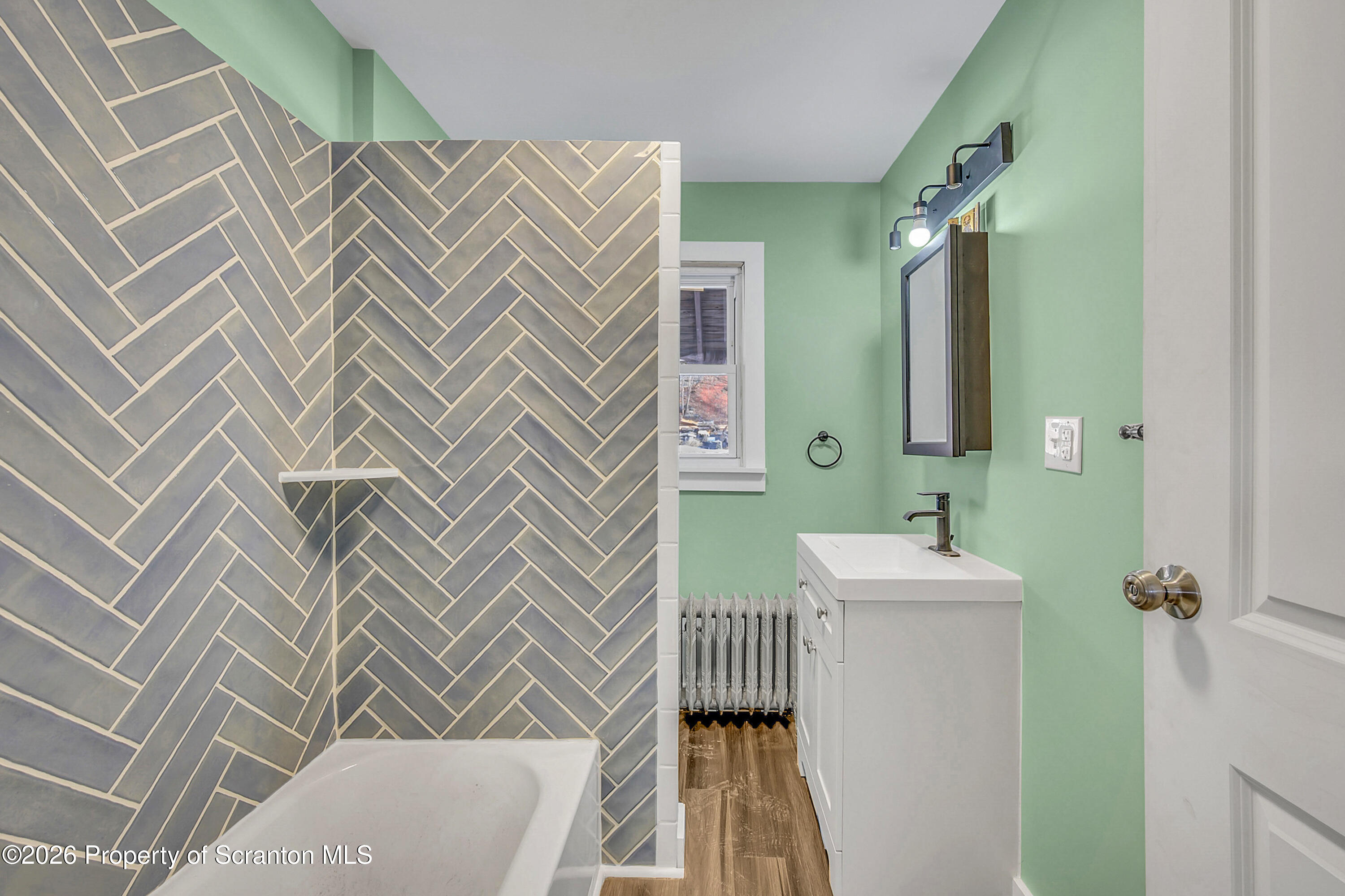 2309 Ash Street Scranton, PA 18510 - Photo 14 of 46 a bathroom with a sink and a mirror