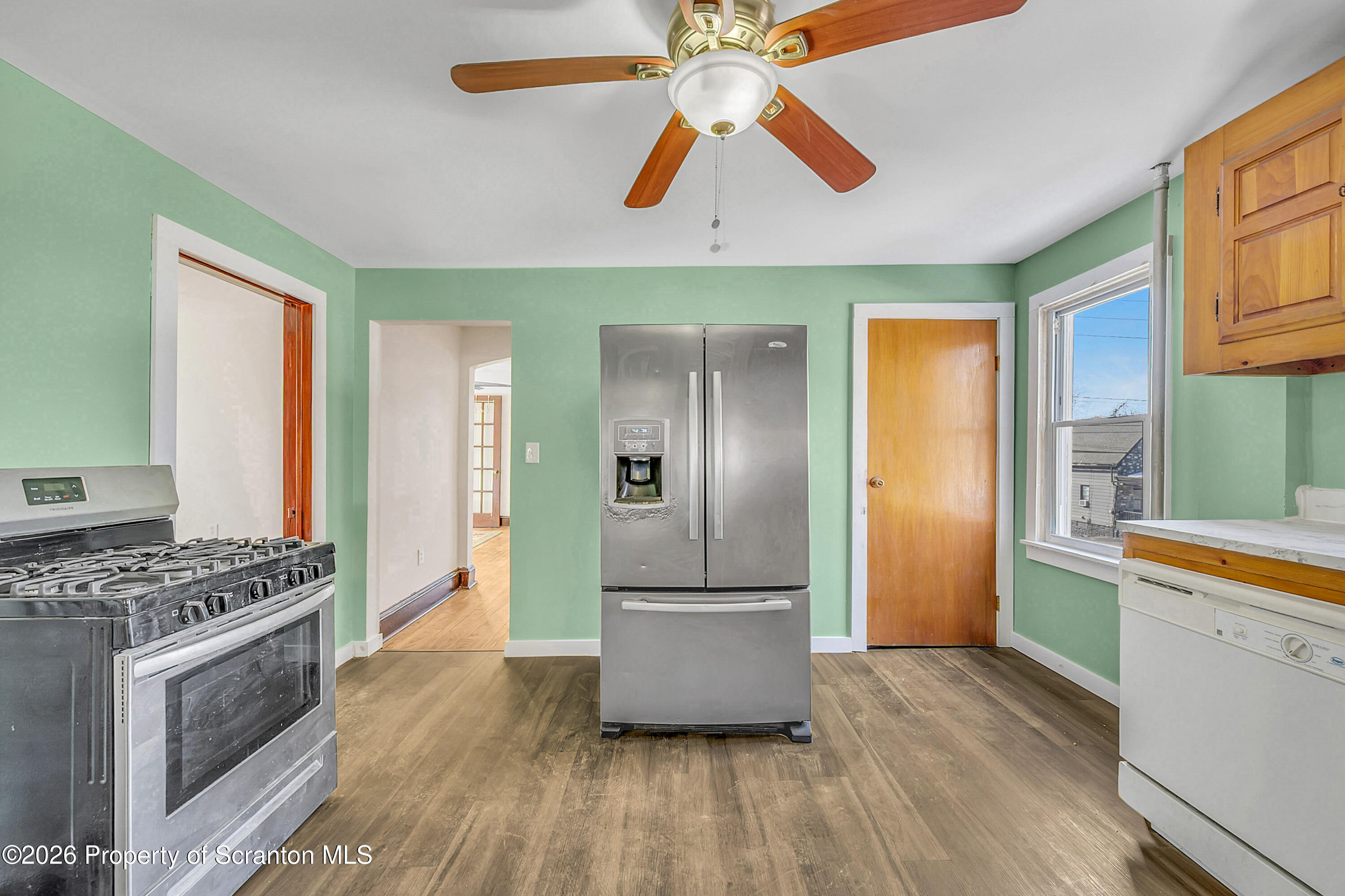 2309 Ash Street Scranton, PA 18510 - Photo 17 of 46 a kitchen with stainless steel appliances granite countertop a refrigerator and a stove top oven