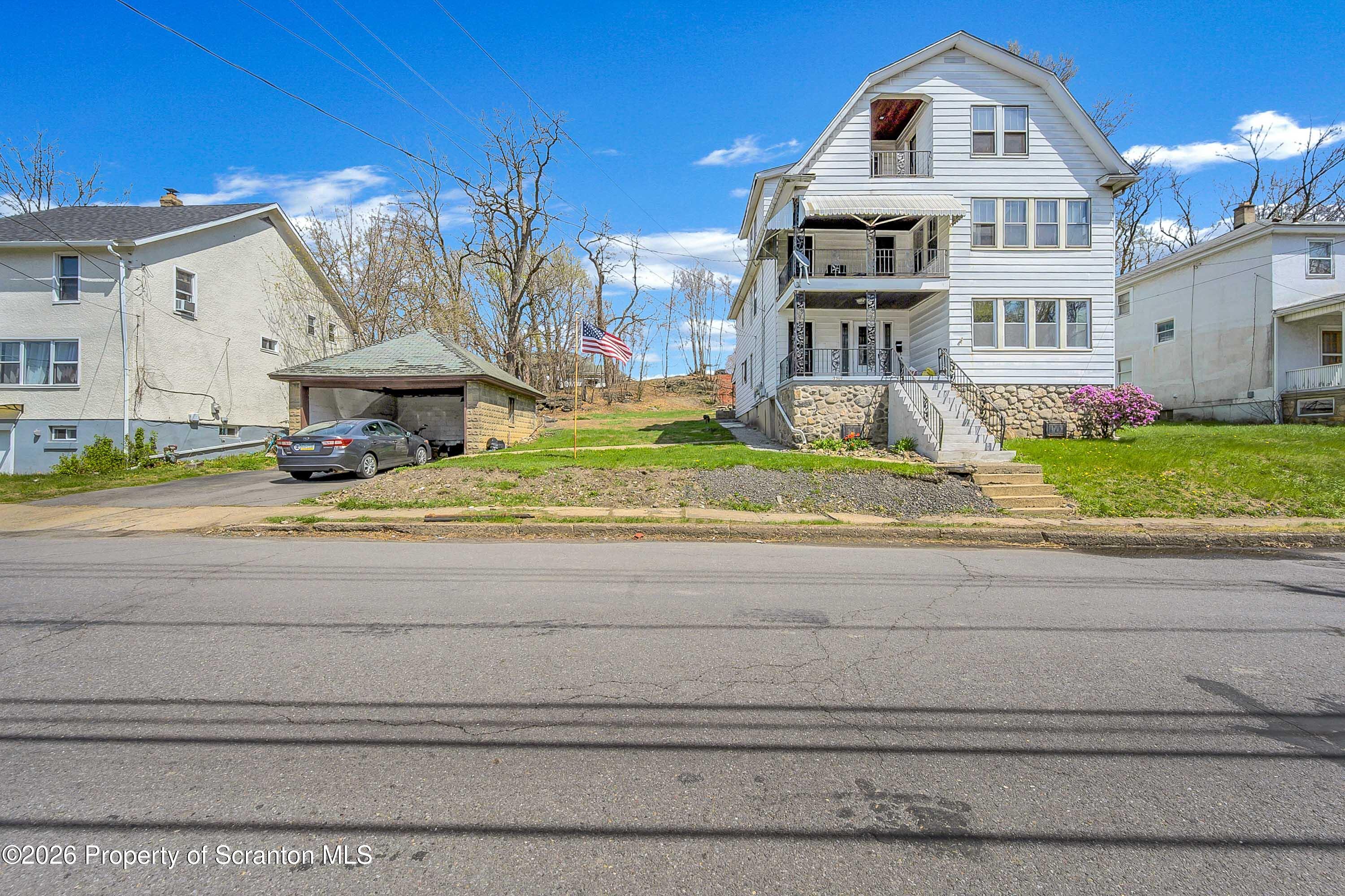 2309 Ash Street Scranton, PA 18510 - Photo 2 of 46 a front view of a house with a yard