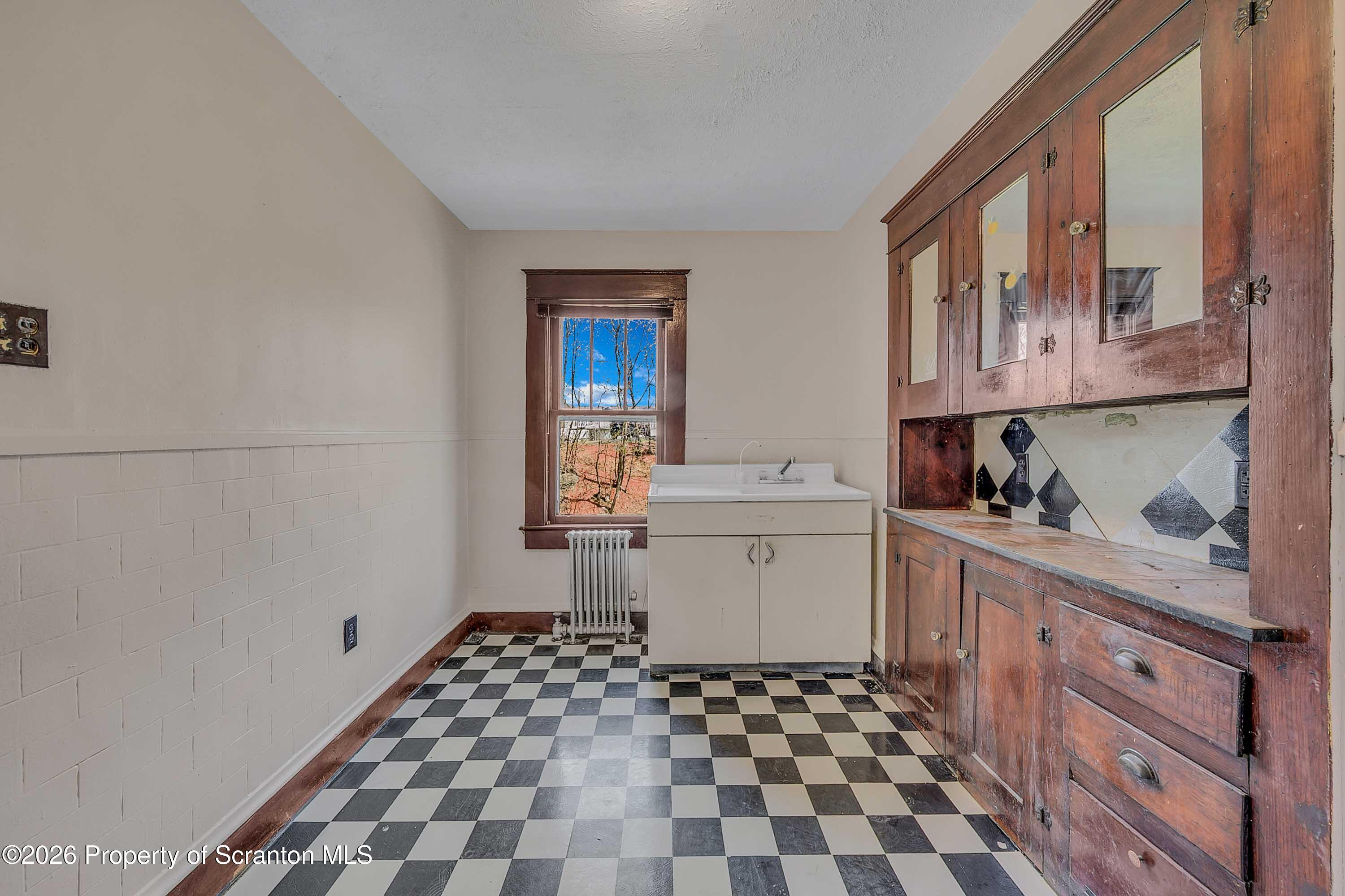 2309 Ash Street Scranton, PA 18510 - Photo 33 of 46 a kitchen with a cabinets and window