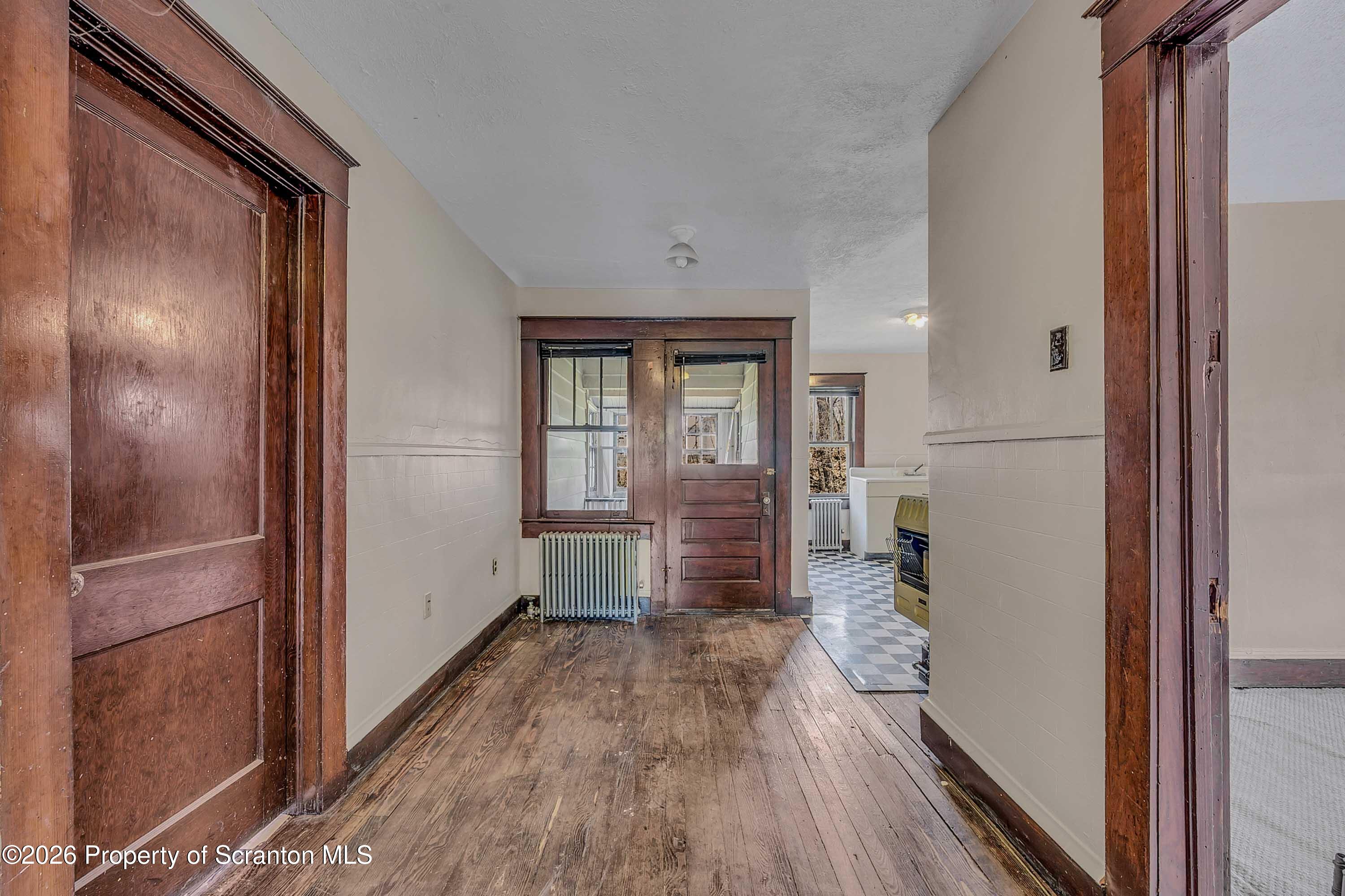 2309 Ash Street Scranton, PA 18510 - Photo 36 of 46 a view of hallway with livingroom and wooden floor