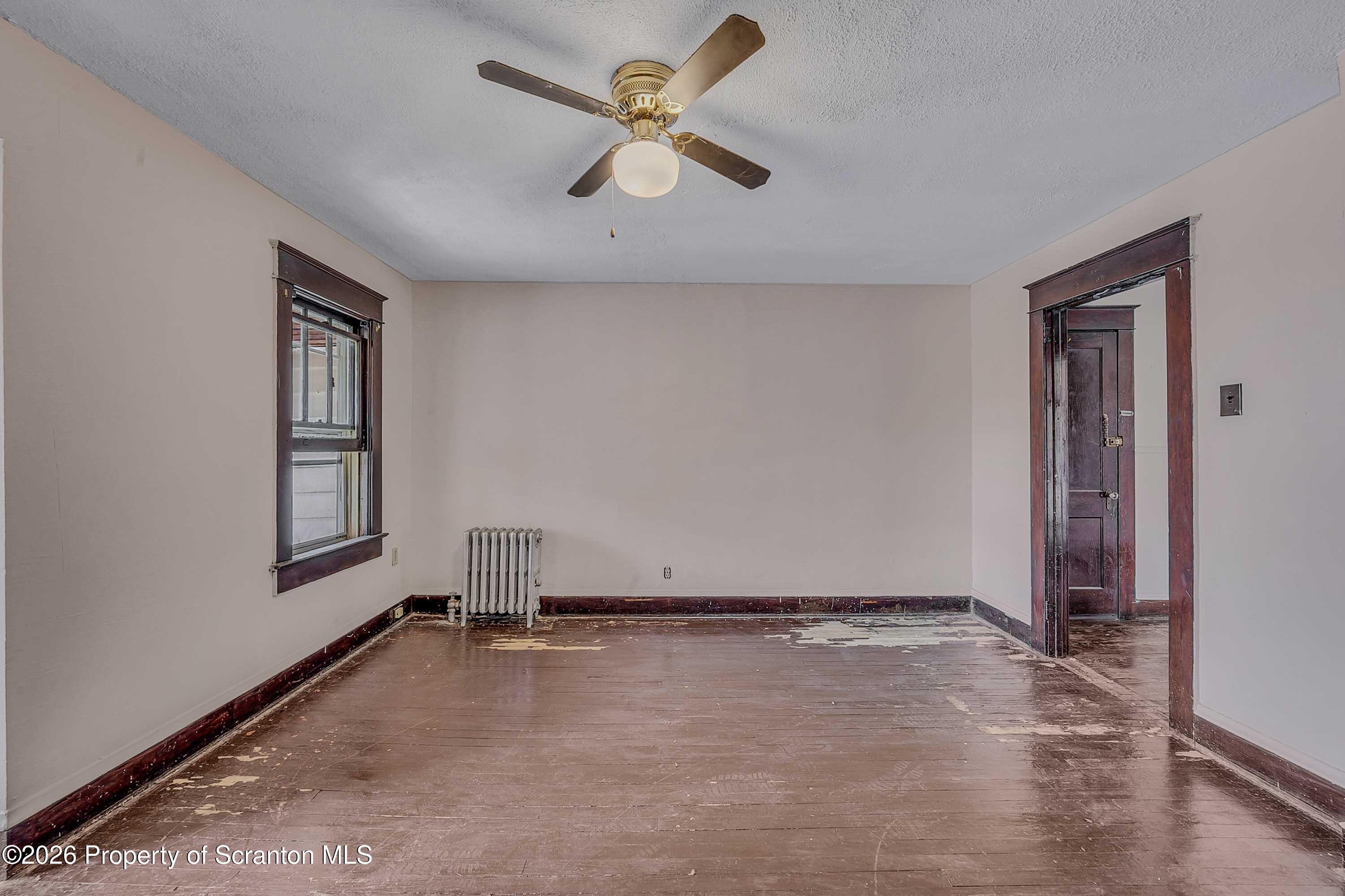2309 Ash Street Scranton, PA 18510 - Photo 39 of 46 an empty room with windows and fan