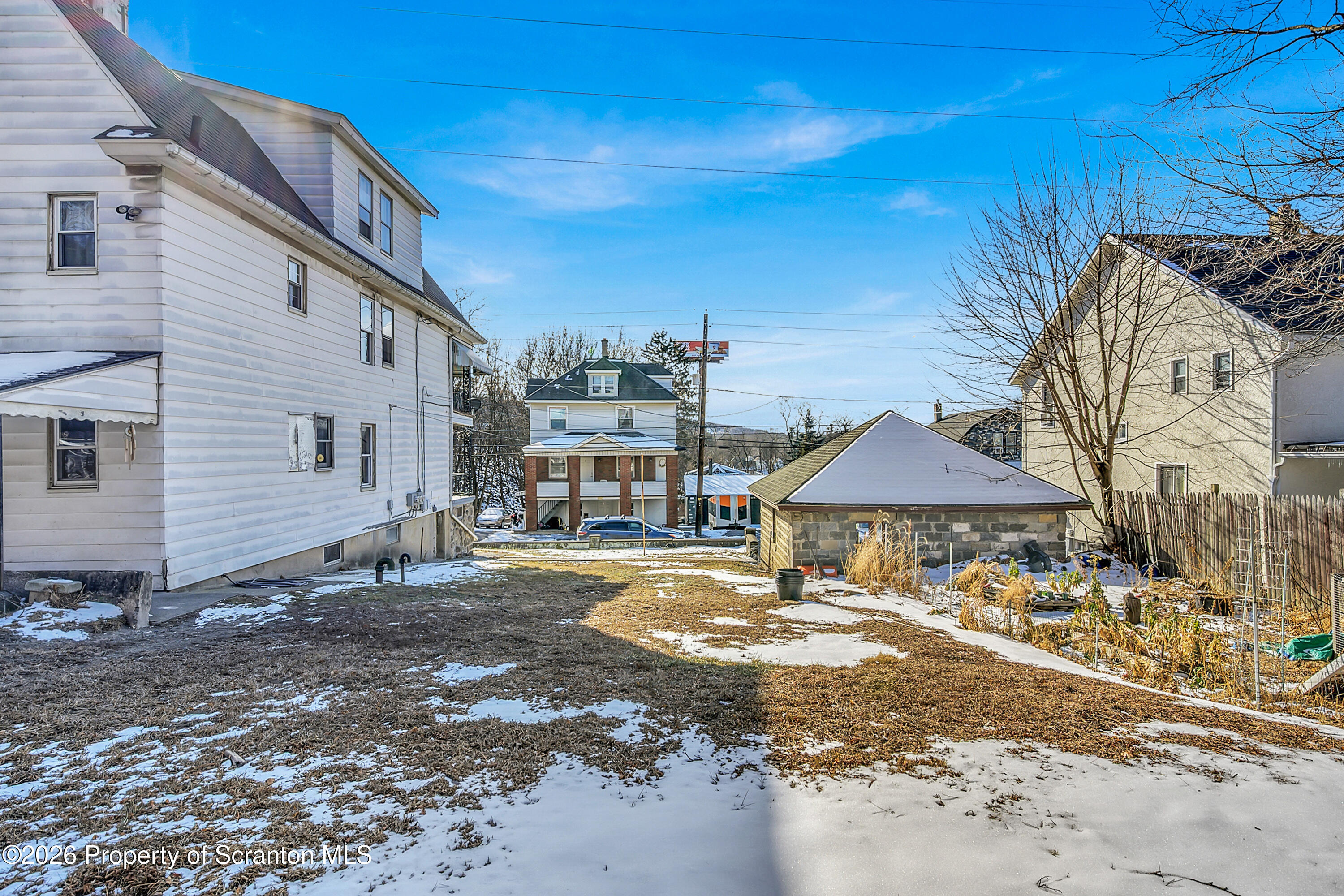 2309 Ash Street Scranton, PA 18510 - Photo 43 of 46 a front view of a house with a yard