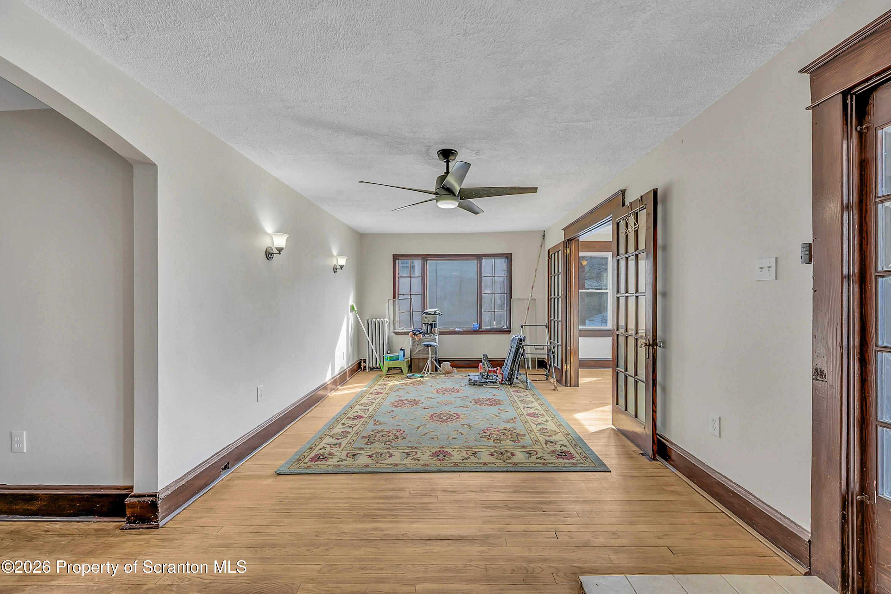 2309 Ash Street Scranton, PA 18510 - Photo 9 of 46 a view of a livingroom with wooden floor and a ceiling fan