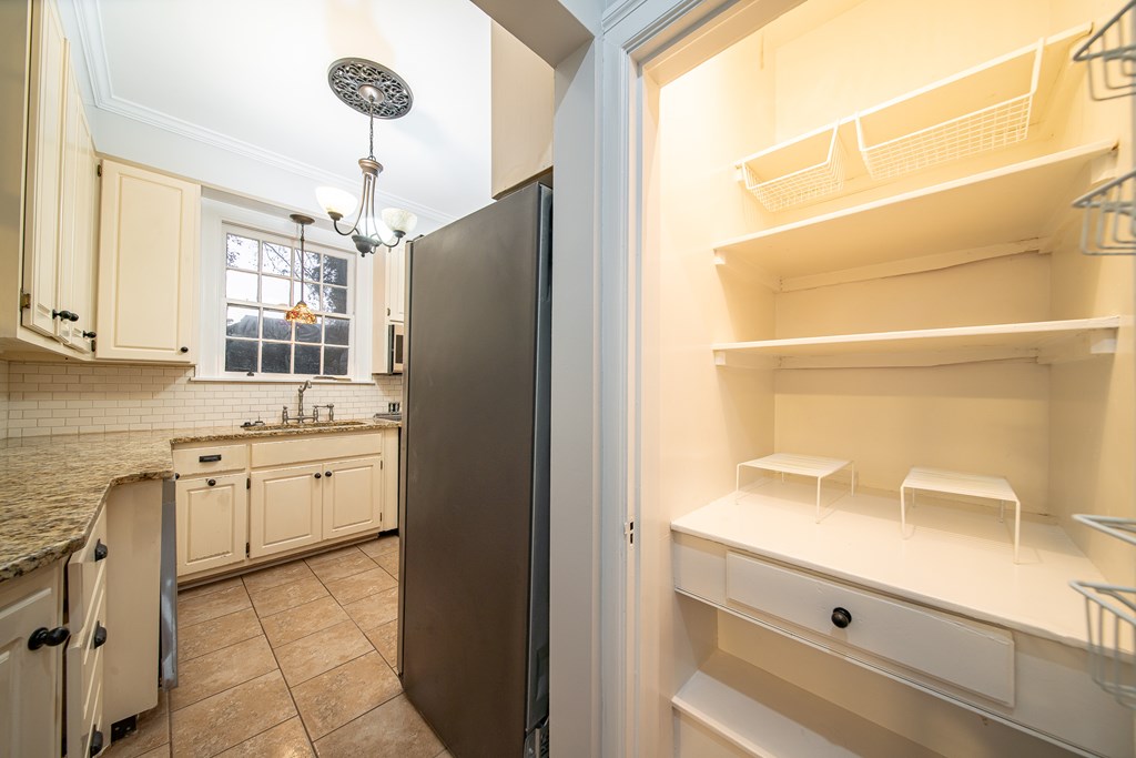 2010 Cherokee Avenue Columbus, GA 31906 - Photo 32 of 54 a kitchen with granite countertop cabinets appliances and a counter top space