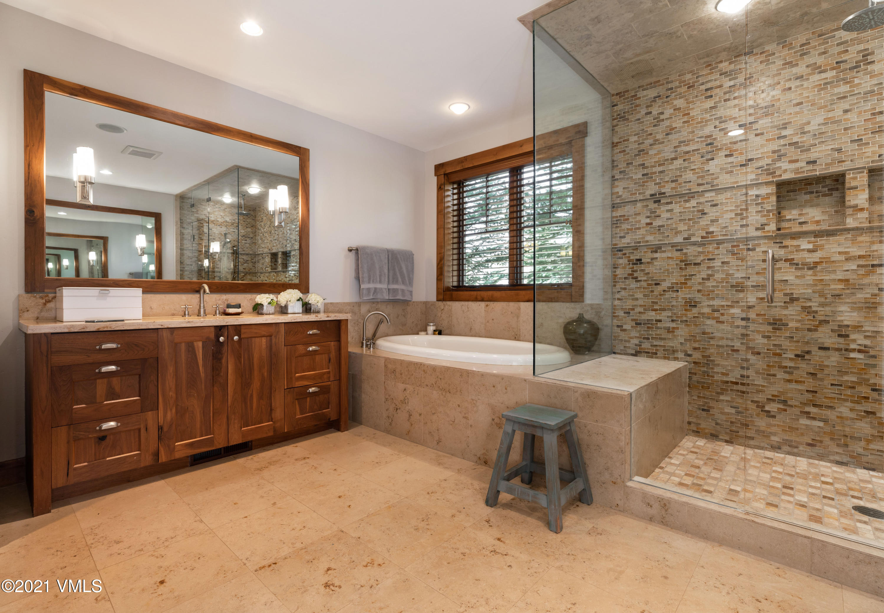 204 Remington Trail Edwards, CO 81632 - Photo 14 of 30 a spacious bathroom with a sink mirror and a bathtub